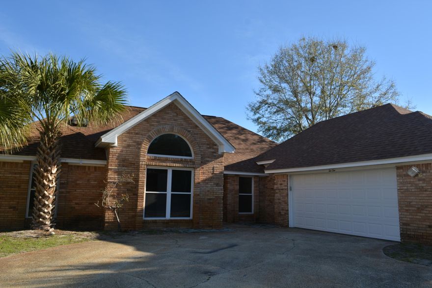 REO. Great Location! Close to Shopping, Schools and Restaurants! All Brick Lakefront featuring 3 bedrooms and 2 full baths. *NEW ROOF, NEW GARAGE DOOR, NEW STAINLESS APPLIANCES, FRESHLY PAINTED, NEW CARPET* Open Floor plan with Dining Room and Large Kitchen. Kitchen features granite counter tops. Living Area features a gas log fireplace. Home is Tile throughout with exception of bedrooms which are carpeted. Backyard has a deck to sit and enjoy the view of the lake in your own backyard. Home also has an attached 2 car garage.