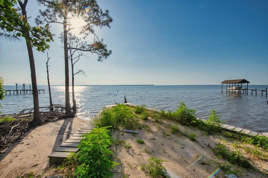 Beautiful WATERFRONT property on Blackwater Bay! Approx. 90ft of waterfront with a lot that has been graded for building. With close to 7ft elevation, this lot appears high and dry. This lot also features a top-quality vinyl sea wall which can save the new owner close to $30k when building. This lot is mostly cleared and well maintained and ready for you! This area of Milton is great for fishing, Crabbing, and water sports. There are multiple free county boat launches and you're not far from the Yellow river, Blackwater river, Pensacola Bay, and access to the Gulf of Mexico! This is a quiet spot with 'very' little traffic on a cul de sac & the homes close by are well maintained.