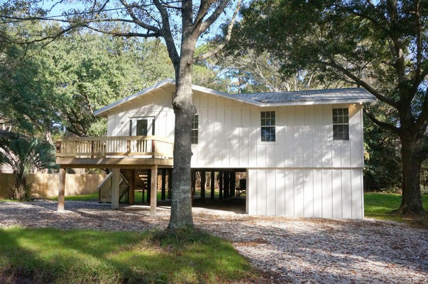 Fantastic family home with an open floor plan. Amazing island kitchen with all brand new appliances. Large master bedroom with a fabulous master bath, jetted tub and sizable shower. Ample master closet for a growing wardrobe. Master bedroom has vaulted cedar ceiling throughout and patio access. Three additional bedrooms with walk in closets. Separate laundry room with barn style sliding glass door. Great backyard surrounded by trees. Large storage room below the house, next to carport. Deeded bay access. Buyer must verify all dimensions.