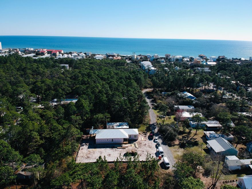 New Home under construction with a pool in Old Seagrove Beach. Great location only 1800 ft to beach access an beach area to sit on for the neighborhood. This coastal cottage has an open floor plan with 10 ft ceilings throughout. The floor plan is set up to be an awesome vacation rental with 5 Bedrooms / 4.5 Bath + Study. The spacious kitchen has a 10ft island, white shaker style cabinets , under cabinet lighting, quartz counter tops, complete Bosch appliance package including a double oven, gas cooktop, vent hood, microwave, dishwasher & refrigerator. Coastal crown molding is offered in all living areas as well as the master bedroom. There are ship lap accent walls in the entry way & the living room.
Luxury vinyl plank floors will be offered throughout the home including the bedrooms.
