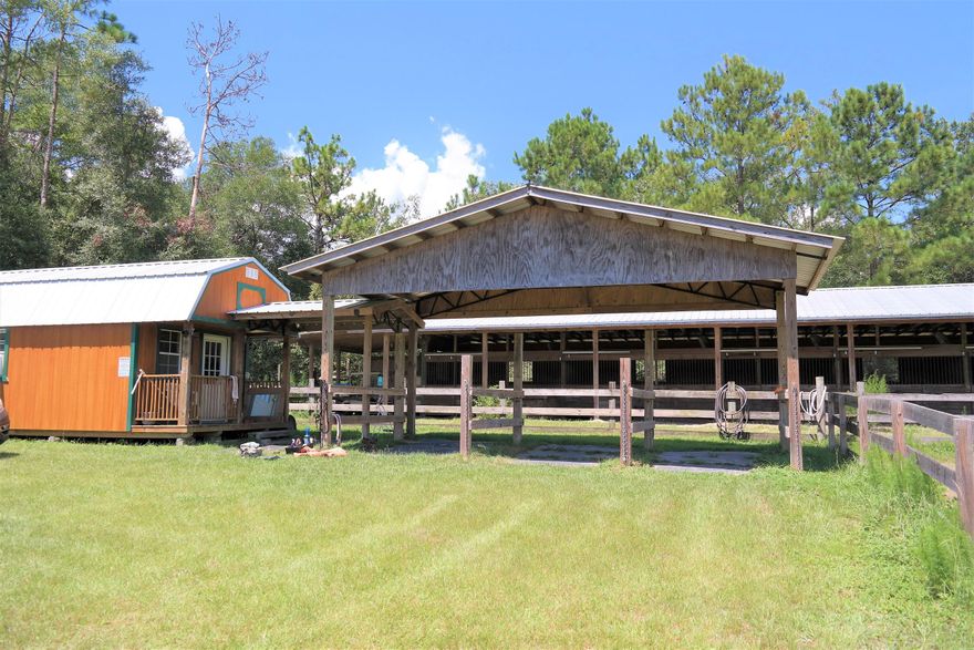 Looking for a place for horses, cattle, or numerous other farming activities? This may be the property for you! 7 pastures, total of 13 enclosed stalls, 10 covered shelter/feeding stations, air conditioned tack shed w/ attached wash station, multiple corrals & training rings, dog kennels. The main barn, near house has 5 stalls (2 12x12 foaling stalls & 3 10x10 standard stalls). Pastures are separated to ensure that no animals will be fighting across the pastures. This would also be beneficial for buyers looking to include more exotic or a mix of farm animals (Alpacas, Llamas, Ostrich...). Also, 2005 mfd. home is 2310 sf, 4 BR/2ba. PLEASE DO NOT ENTER PROPERTY UNACCOMANIED BY AN AGENT! Majority of value in land & will NOT meet FHA/VA guidelines. Farm Credit of NW FL is best financing option