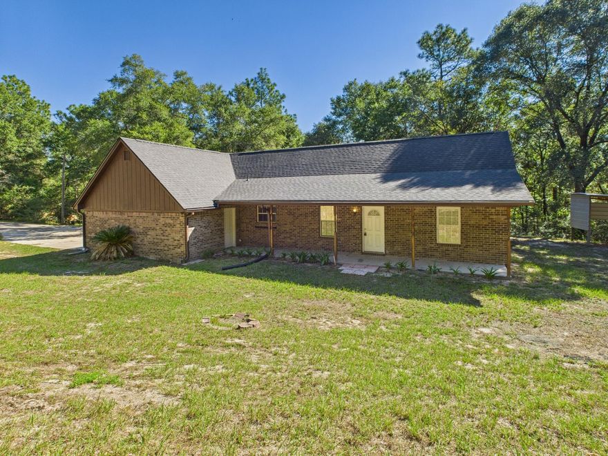 **Back on the market due to no fault of the seller**Welcome to 1134 Tranquil Breeze Way!This desirable 3-bedroom, 2-bath brick home is nestled on 5.26 acres in peaceful Holt, FL. Built in 1997, this 1,496 sq ft property features a split floor plan, vaulted ceilings, oversized 2 car garage for the perfect blend of space, privacy and comfort.  Enjoy the benefits of 2025 updates including a new roof, water heater, fresh carpet, updated electrical panel, wood rot repair, and more! Giving the buyer peace of mind and added value.  Zoned for Baker School K-12 and minutes from I-10 for easy access to Crestview, Pensacola, and Eglin. Don't miss your chance to capitalize on this rare acreage opportunity