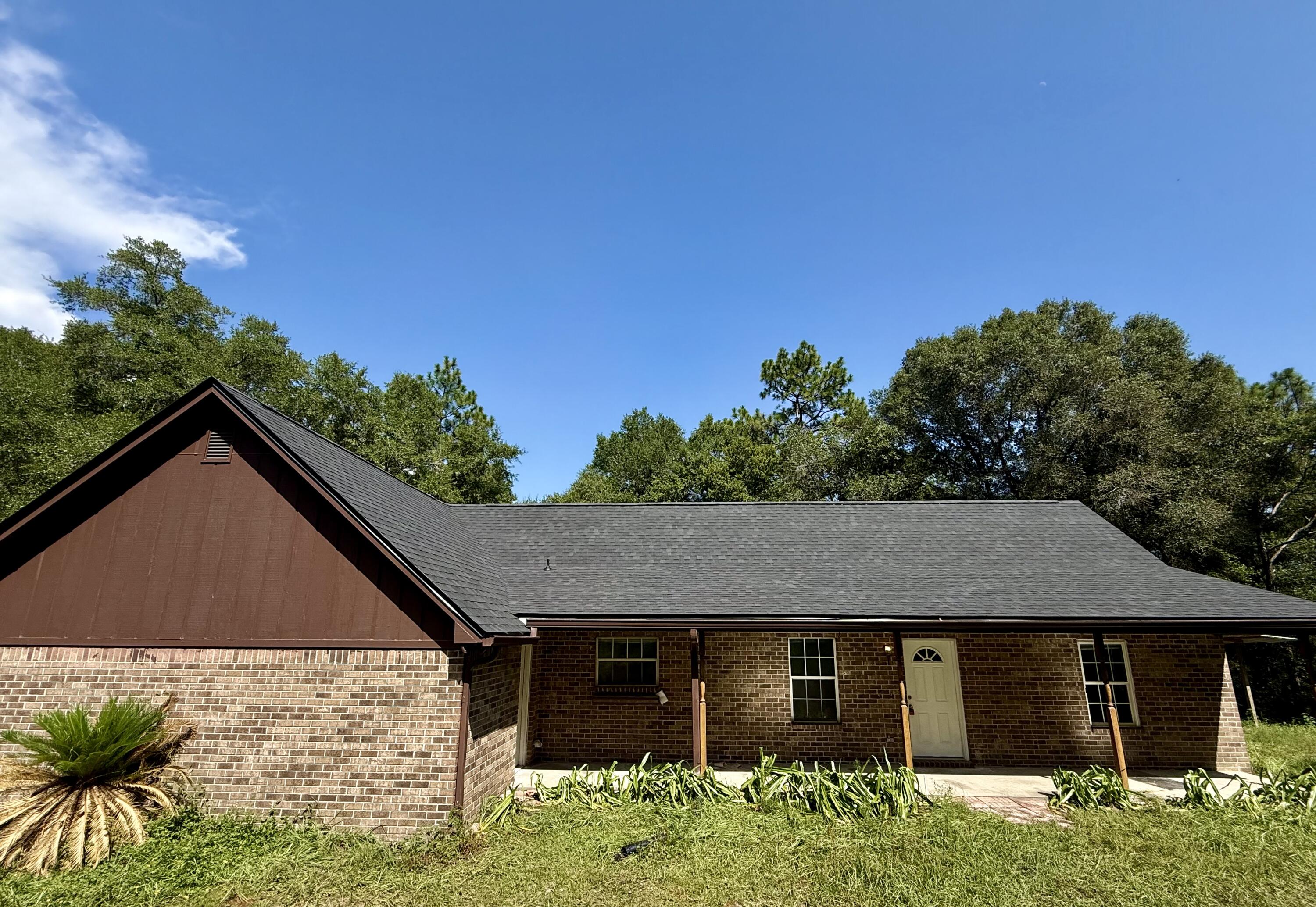 Welcome to 1134 Tranquil Breeze Way!This desirable 3-bedroom, 2-bath brick home is nestled on 5.26 acres in peaceful Holt, FL. Built in 1997, this 1,496 sq ft property features a split floor plan, vaulted ceilings, oversized 2 car garage for the perfect blend of space, privacy and comfort. Enjoy the benefits of recent updates including a new roof, water heater and fresh carpet, all completed in 2025. The seller will be updating the electrical panel and making additional improvements, giving buyers peace of mind and added value. Zoned for Baker School K-12 and minutes from I-10 for easy access to Crestview, Pensacola, and Eglin. This home is packed with potential--don't miss your chance to capitalize on this rare acreage opportunity!