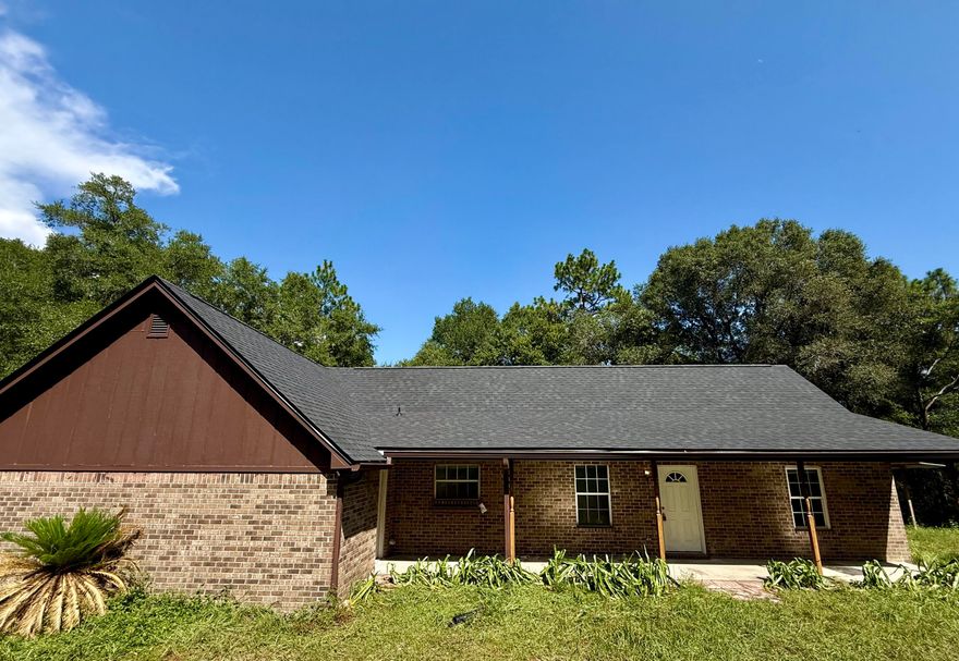 **Back on the market due to no fault of the seller**Welcome to 1134 Tranquil Breeze Way!This desirable 3-bedroom, 2-bath brick home is nestled on 5.26 acres in peaceful Holt, FL. Built in 1997, this 1,496 sq ft property features a split floor plan, vaulted ceilings, oversized 2 car garage for the perfect blend of space, privacy and comfort.  Enjoy the benefits of 2025 updates including a new roof, water heater, fresh carpet, updated electrical panel, wood rot repair, and more! Giving the buyer peace of mind and added value.  Zoned for Baker School K-12 and minutes from I-10 for easy access to Crestview, Pensacola, and Eglin. Don't miss your chance to capitalize on this rare acreage opportunity