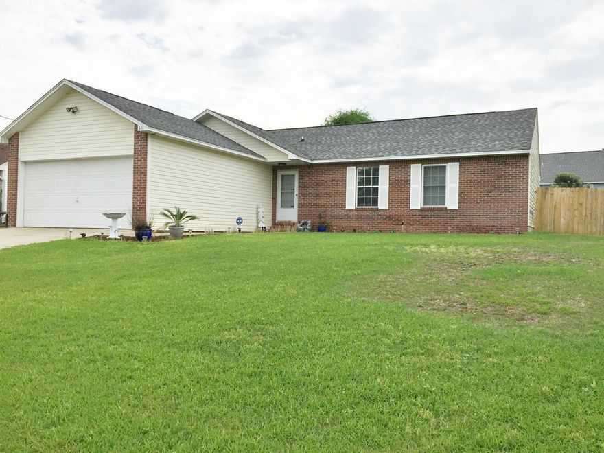 Special Home for Special Family that can appreciate the upgrades such as Solar Electric which brings bill to $20 a month. Yes, approx. $20 month!! Additional upgrade items include 16 seer AC, water softener, hurricane brace and shutters, Geothermal hot water heater, and more! Lovely tile and wood laminate flooring. Large Family room with gas Fireplace & Large Kitchen/Dining. Room for China Hutch on wall next to Dining table. Roomy Master Bedroom with WALK-IN Closet & en suite Bath. Nice backyard with room for children to play and/or pets.Top of the line home!! Come see !!