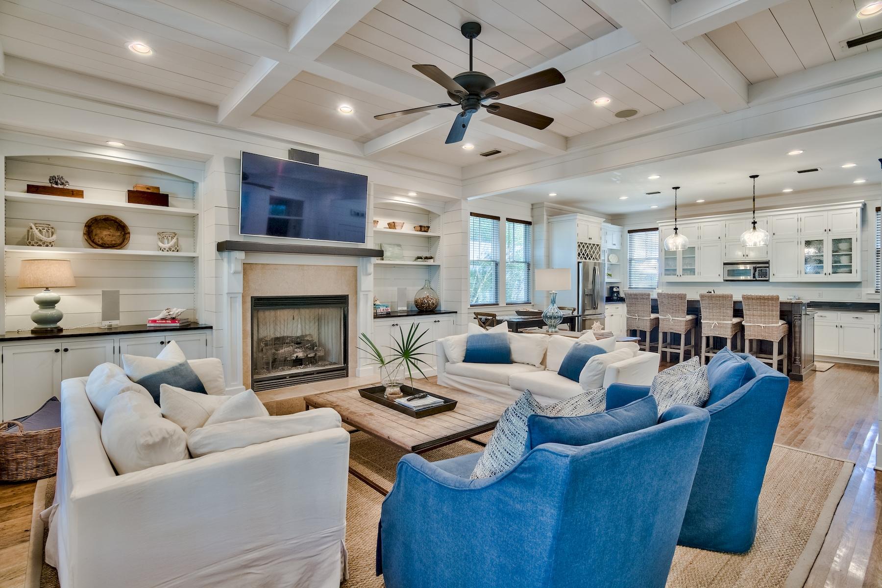 Property currently under contract with a kick out clause. Tucked in Phase I of WaterColor, this inviting coastal retreat offers elegant finishes and close proximity to Western Lake and infamous Emerald Coast beaches. The home features an open floor plan with beautiful hardwood flooring and shiplap accents on the walls and ceiling. A perfect place to gather with family and friends, the living room features a fireplace, and the home also offers a surround sound system. A gourmet kitchen provides ample storage, granite countertops, and a breakfast bar. Two additional dining areas are located inside while three sets of French doors lead out to an expansive screened porch with plenty of room for outdoor dining and entertaining. A guest suite and a laundry room are located on the first floor,