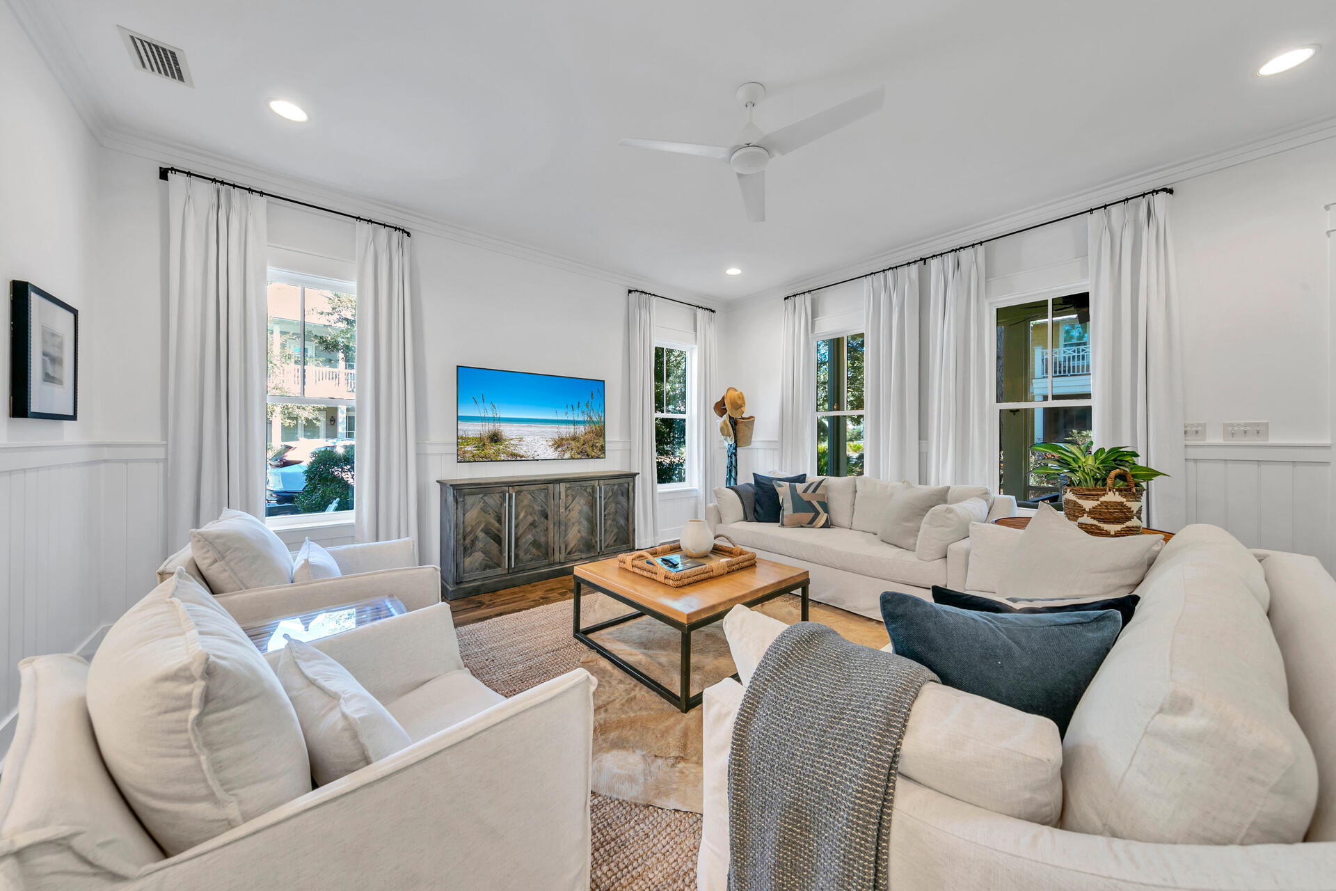 Welcome to 'Stay Salty', a beautifully updated five-bedroom, four-and-a-half-bath home located on a highly sought-after corner lot in the WaterColor community. Professionally designed by Three Dog Design and sold fully furnished with a four-person golf cart, this property comfortably sleeps 12 and has been extensively upgraded throughout. A true turnkey opportunity for luxury living or high-performing short-term rental ownership.The open, light-filled floor plan features high ceilings and coastal-inspired interiors. The spacious living and dining areas flow into a custom kitchen with quartz countertops, stainless steel appliances, and a large island with seating. The main-level primary King suite offers a spa-style bath, while upstairs includes additional king and queen suites, a double-queen room, a twin bunk nook with a closet, and a secondary living area.
Outdoor spaces include a screened patio, covered front porch with grill, upper balcony (off the upstairs king suite), and expansive side deck surrounded by mature landscaping. The home includes a garage suitable for the golf cart or a small vehicle, plus driveway parking for two vehicles.
Rental performance is exceptional, producing $130,508.05 in 2024 gross income and $153,251.76 already booked for 2025, with new reservations coming in daily and lots of owner use! Over 49 five-star reviews and a 12% repeat guest rate year-to-date highlight its proven appeal.
Owners and guests enjoy full access to WaterColor's top-tier amenities including resort-style pools, tennis and pickleball courts, trails, parks, and the private WaterColor Beach Club. Just minutes from Seaside, 30A dining, and the Gulf, this corner-lot home combines design, comfort, and strong investment potential in one of 30A's most desirable neighborhoods.