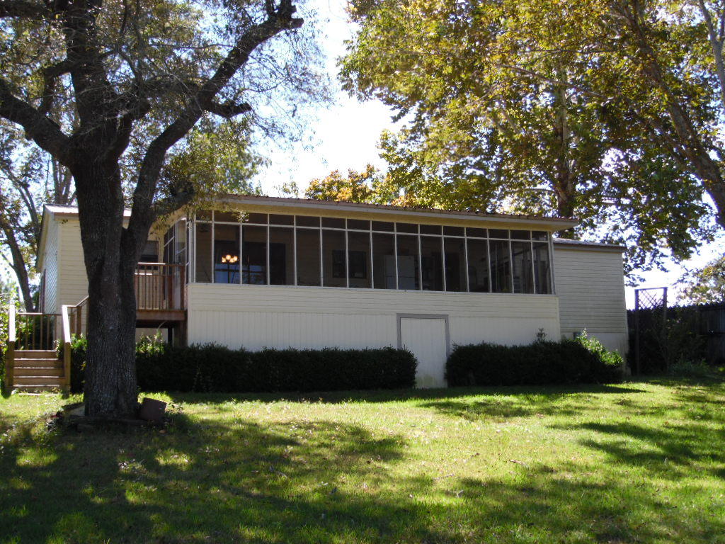 Don't let the age fool you! You have got to see this to appreciate it! This would make a great primary residence or weekend fishing getaway! This partially furnished home has been well maintained and has approx 70 ft on Lake Juniper. This home has been renovated with a new HVAC in 2014, new seawall, new dock and new porch stairs in 2013. Plumbing was redone in 2011 and metal roof was installed in 2004. The home has an open floor plan with split bedrooms with storage options built in everywhere, including each bedroom having its own walk in closet. There is a ton of outdoor living space starting with the screened in porch that is 10x29, a new dock that is 8x12 and a boat house which has electric boat lift. This home comes ready for you to hit the water, so make your appointment today!