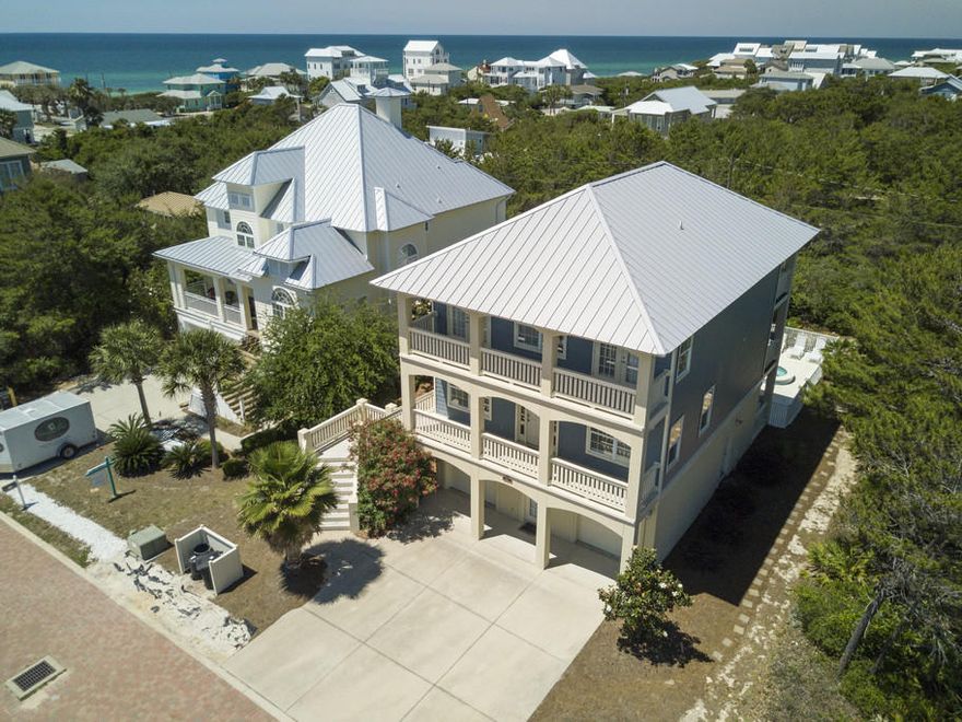 This delightful 5 bedroom, 4 and a half bath property consists of a large 3 story home with a 2 story guest house, a pool, hot tub, 5 balconies, gulf views & moments from the beach. It is located in Inlet Beach which is centrally located to the beach, the best dining, unique boutique shopping, art galleries, art festivals, outdoor concerts, bike paths and some of the most challenging golf courses the gulf coast has to offer. 30A is a walk or bike ride away and you have easy access to Hwy 98, allowing you to explore the nearby cities of Destin or Panama City Beach, as well as, the Northwest Florida Beaches International Airport. The main house has a private bedroom and full bath on the 1st floor, along with an extra-large 2 car garage. The main living space is