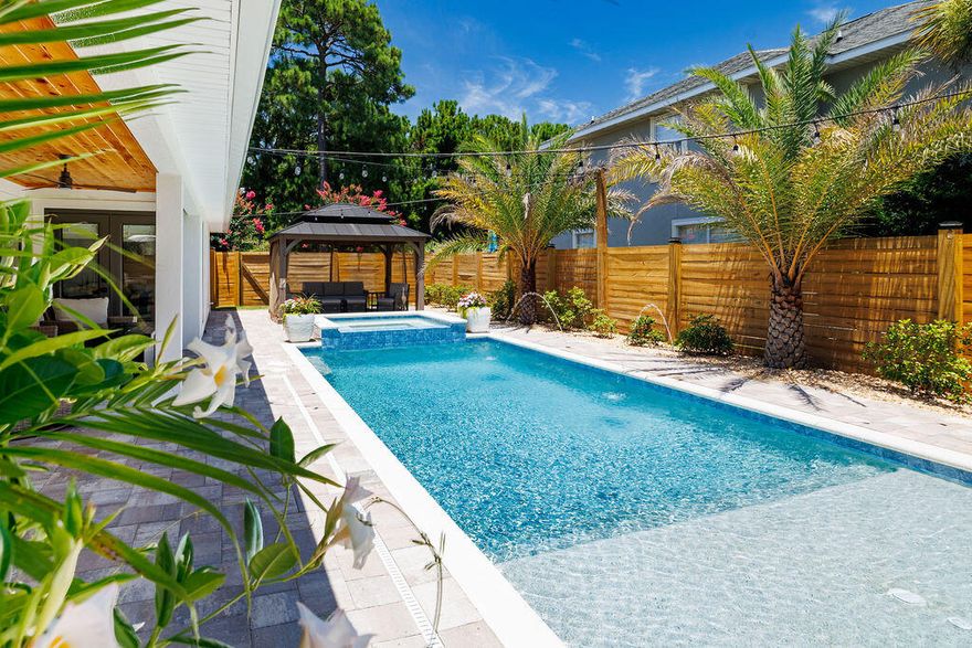 Absolutely Incredible!! Completely furnished home has been renovated from the ground up, showcasing exceptional craftmanship and attention to detail throughout. Step inside to discover stunning finishes, premium materials, designer lighting, and carefully selected furnishings-paired with an Outdoor Oasis that is truly one of a kind., The backyard is a showstopper, featuring a brand new heated pool with intergraded  hot tub, a beautiful waterfall effect-creating a resort style atmosphere perfect for relaxing and entertaining. Inside, the thoughtfully reimagined layout offers an expansive Open Floorplan, a High-End Chef's Kitchen with Bosch Appliances, a bright and airy dining area, and a living room anchored by a striking stone accent wall. If you are loo ing for a home that offers luxury, comfort, turnkey, furnishings, and timeless design-this is the one! Schedule your private showing today and fall in love with every inch!