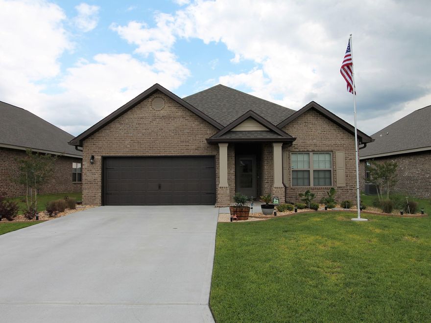 Redstone Commons is centrally located and has a number of amenities such as pool, pavilion with grilling, dog park, kid park and walking trails. You will enjoy the Lamar, featuring 3 bedrooms, 2 bathrooms and a 2 car garage. The open living floorplan allows all to be in the conversation. The kitchen has a large island perfect for either quick meals or as a serving area, granite counters, stainless appliances and high ceilings give the home a light airy feel. With the split floorplan the Master Suite is by itself. Featuring a walk in closet, double vanity sinks with a granite top, tub and separate 5 foot large shower this can be your private oasis. The owners have upgraded this lovely home with a number of features, such as a separate work shop and full gutters, privacy fence, ceiling fans