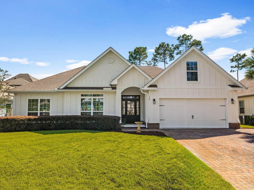 This attractive move-in-ready home comes with its own very private backyard oasis. Swaying bamboo surrounds the partially covered porch and barbecue area, providing a paradise for relaxing and entertaining. The pavered terrace includes a feature fire pit for cozy evenings beneath the stars. Indoors, most of the living space is laid out on the first floor, providing stair-free living. Airy vaulted ceilings and hardwood floors add a luxurious ambiance. All eyes will be drawn to the matte black wood-burning fireplace and deep tray ceiling with shiplap in the sitting room. The great room flows seamlessly through an open arch into a formal dining room, currently doubling as a home office. The updated eat-in kitchen has granite countertops, fresh white cabinets and stainless steel appliances. In addition, there's a wet bar/coffee station with its own refrigerator. A large laundry provides additional storage. Three bedrooms include a spacious master suite and a bunk room with shiplap. Bathrooms include granite vanities, a new glass shower door in the master, and custom drapes in bathroom two. Beneath the hip roof, the second-floor bonus room would make a spacious den, media room or a fourth bedroom. Freshly painted inside and out, the home also has new Zoysia grass laid to the front and rear. A new irrigation system keeps landscaping in good shape, even when owners are absent. The two-car garage boasts solar power and built-in cabinetry, and an alarm system covers the entire home as well as the ability to add a whole-home generator with a hookup already in place. Cypress Breeze Plantation allows short-term rentals for those looking for investment. The outstanding amenities make it a very popular community for families. There's a 14,000-square-foot three-tier pool with waterfalls, gated security and beach access. Nearby, Gulf Place has a choice of restaurants and shopping, and there's access to a deep-water boat launch at Cessna Landing. 