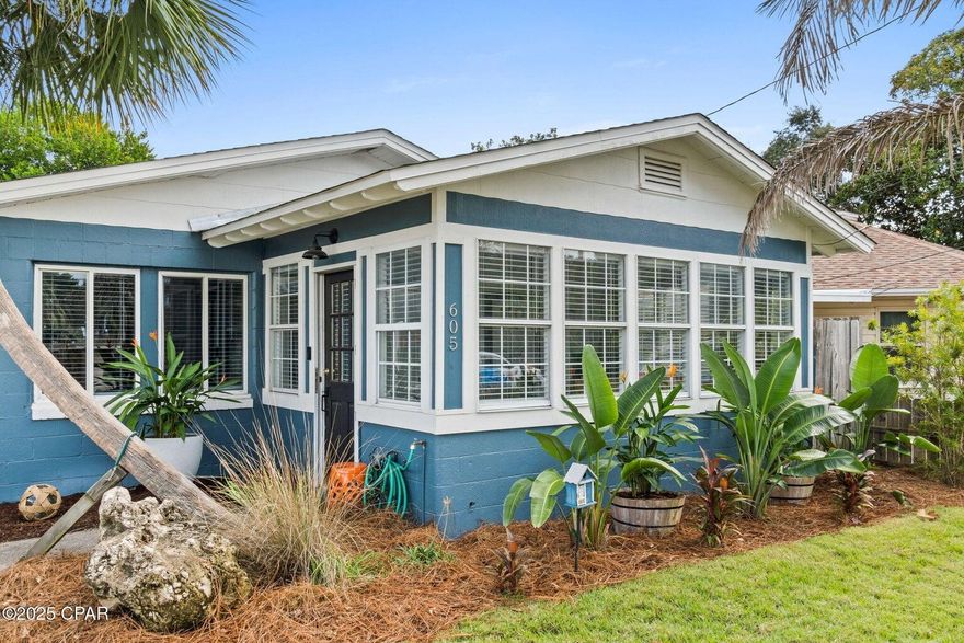 Coastal Charm Meets Modern Luxury Renovated Beachside Retreat.Discover the perfect blend of coastal living and contemporary design in this beautifully renovated beach cottage, located just a 5-7 minute walk from the sugar-white sands of Panama City Beach. Completely updated and move-in ready, this home offers both lifestyle appeal and exceptional value.Renovated in 2023, the home features new flooring throughout, along with fully updated electrical and plumbing systems, providing peace of mind for years to come. The kitchen is a standout, showcasing Caribbean Sunset Brazilian granite countertops, modern cabinetry, new appliances, and generous prep space ideal for everyday living or entertaining. A custom surfboard light fixture adds a distinctive coastal touch, creating a creating a warm and inviting atmosphere.

The bathroom has been thoughtfully redesigned with a spa-inspired feel, featuring a walk-in shower with an oversized rainfall shower head, contemporary finishes, and a unique porthole accent salvaged from a well-known local landmark, adding character and a sense of local history.

The flexible floor plan enhances functionality and value. The main living area flows into a versatile flex room currently used as a dining space, which can easily convert into a second bedroom, home office, or den. A spacious walk-in closet offers excellent storage, while a hidden bookshelf door connecting the rooms adds a rare and charming design feature.

Outside, enjoy professionally planned landscaping with strong curb appeal and a private backyard oasis complete with pavers and a designated grilling area, perfect for entertaining, relaxing, or enjoying coastal evenings.

The home is offered mostly furnished, excluding a few sentimental items. Whether you're seeking a primary residence, second home, or investment opportunity, this property delivers location, upgrades, and character in one exceptional package.

Schedule your private showing today and experience this unique coastal retreat for yourself.
