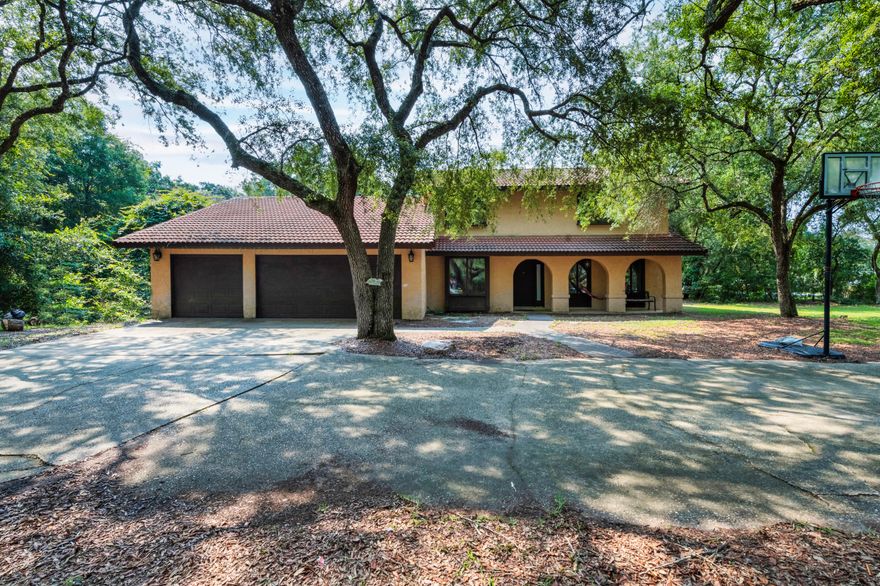 Great Location!  5 bed/2.5 bath home on a large corner lot in Bluewater Bay.  Stucco exterior, tile roof, 3 car garage and a circular driveway.  The first floor has two spacious living areas, one with a real wood burning fireplace, two bedrooms and a half bath.  The kitchen has stainless appliances, granite countertops, a breakfast bar and a seprate dining area.  Upstairs is the Master Suite, along with two additional bedrooms and a full bath.  Tile floors throughout much of the house, along with carpet in the upstairs bedrooms and Vinyl Plank Flooring in the living room and main floor bedrooms.  The large, fenced backyard has a pool that was installed in 2017.  A water softener was installed in 2021.  Centrally located with access to golf, tennis, swimming and a marina, not to mention minutes from the beaches, military bases, schools, shopping and restaurants.  This house has so much potential, a little TLC would go a long way to make it your forever home.