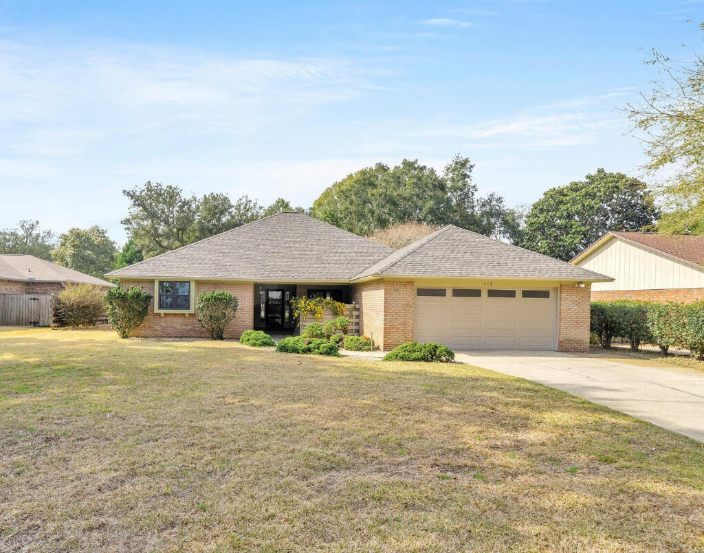 Spacious 3 bedroom 2 bath home in the highly desirable Bluewater Bay area. This brick ranch home welcomes you with a large living room complete with cove ceiling, wet bar, and a brick fireplace. Adjoining is the formal dining room and the kitchen with maple cabinets, quartz countertops, and all new appliances. Also off the living room is a screened in porch and to the rear of the home, an extra family room with lots of natural sunlight. Popcorn ceiling removed, fresh paint, new flooring, new door hardware, and updated LED lighting give the home a beautiful update. The home's windows and sliding glass doors were replaced in 2017/2019 and are now impact (hurricane) rated. Roof FEB 2024, HVAC JAN 2023, HWH NOV 2023.