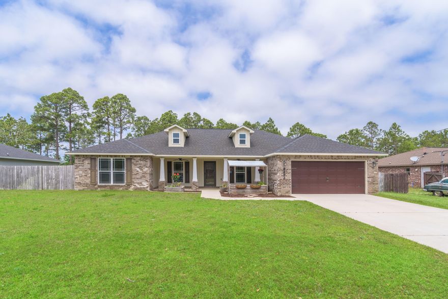 Nestled in the heart of Navarre, this 4 bedroom Craftsman Style home offers an office (not counting office as 4th bedroom, this is a true 4 bedroom home), a formal dining room and large covered lanai. The kitchen comes equipped with granite countertops, island with additional storage, stainless steel appliances, pantry, built-in microwave, electric cooktop, fridge with ice and water dispenser and granite bar top area onlooking into the living room. You'll enjoy the open split floorplan allowing for privacy for the spacious master suite located on the opposite side of the home. The master bathroom has a double granite vanity, walk-in shower and garden tub with his-and-hers closets. The 3 additional bedrooms share the second bathroom which has a shower/tub combo with a linen closet. Other no