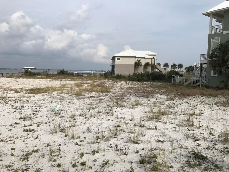 Great lot with a view of the Sound and just a block from the beach. Enjoy the serenity of Navarre Beach in the gated community of only 45 homesites.