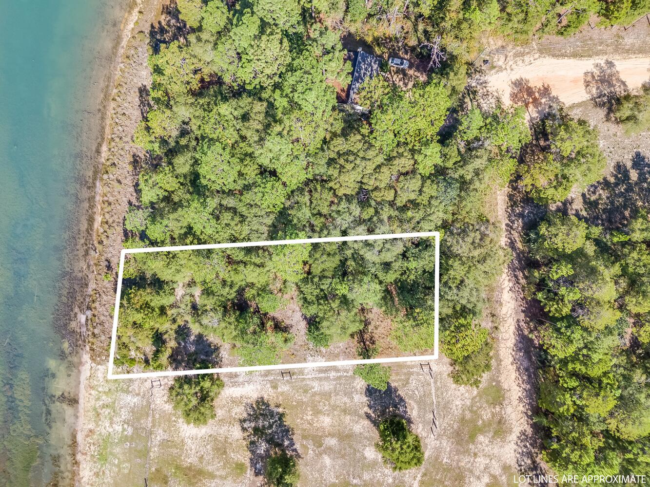 Vacant, Waterfront, wooded lot in rapidly growing Mossy Head community. Easy commute to Crestview, Eglin AFB and Destin. Mossy Head water is available with paid tap fee. Septic tank required. Mobile homes allowed. Property is in Probate, so seller has no previous knowledge or history information available. Buyer to verify all matters of importance.
