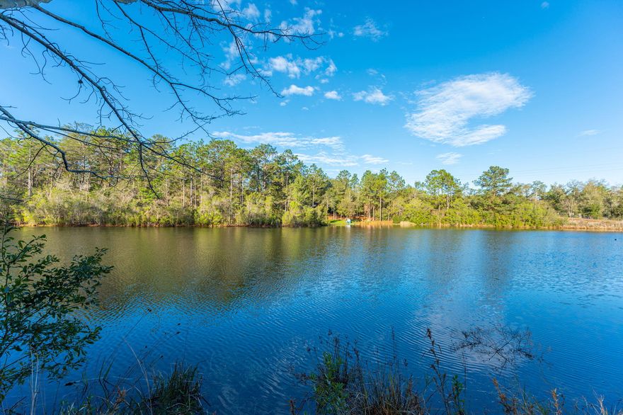 WATERFRONT living at an affordable price! This 4BR/2BA home has been recently updated to include a new metal roof and HVAC system, metal skirting, 10x16 covered front and rear porches, LVP flooring throughout, interior trim, fresh coat of paint, kitchen cabinets & countertops, Frigidaire stainless steel appliance package, light fixtures & ceiling fans, interior & exterior doors, plumbing fixtures,  5' shower unit in master bath and a tub/shower unit in hall bath. The family room area showcases a built-in bookcase and a wood burning fireplace.  Master bedroom suite offers a  10x13 sitting room that could also be used as an office or nursery area. The 2.37 acre parcel is currently zoned AA and has the possibly of  being split into (2) one acre parcels.