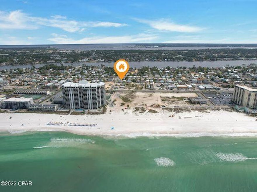 This high and dry lot with gulf views will not last long. This parcel is located within a short distance to the beach and is the perfect spot for permanent residence, short term rental, duplex, triplex, you name it! The opportunities are endless with this amazing location! Survey included with purchase and the seller has plans that can convey as well!