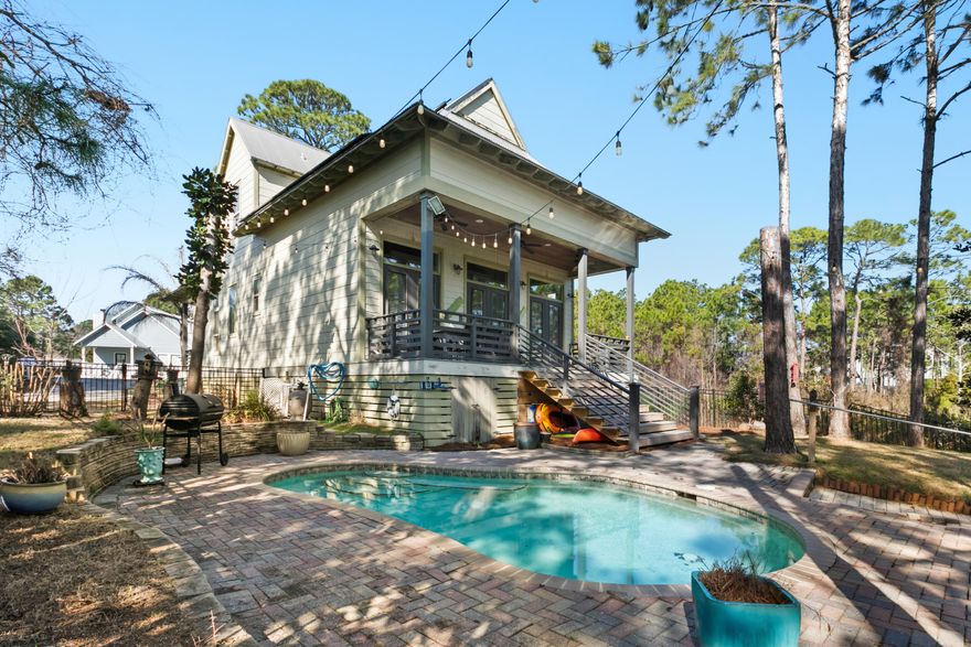 The one you've been waiting for! Custom built home with private pool and a dock overlooking the lake. With no HOA restrictions, this is the best buy for a short term rental home! Deep covered front and back porches provide extra living space. Open kitchen, dining and family room with soaring 2 story ceiling.  Beautiful kitchen with breakfast bar and large walk-in pantry. Fenced backyard with a brick paver patio surrounding the salt water pool. Modified entry with ramp for wheelchair or walker access. Backyard features private dock to fish, kayak, paddle board or lounge with a good book. Resort-style living with easy golf cart or bike ride to all the hotspots minutes away including the beach! Seascape Towne Center is right down the road with restaurants, local events, shopping and more.