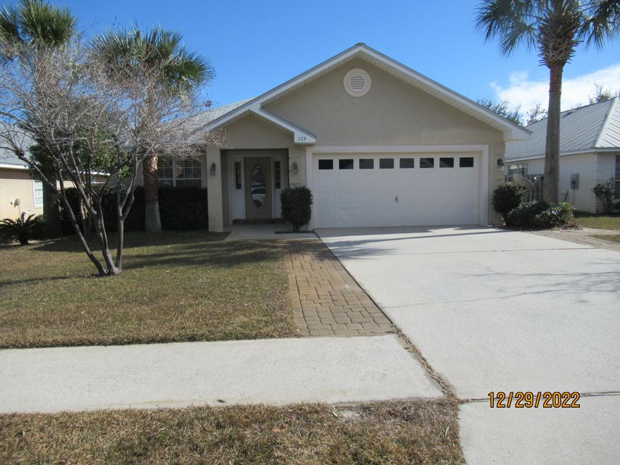 This 4 bedroom 2 bath home offers plenty of living space.  Large breakfast bar,  Plantation Shutters in the living room, extra pavers along the driveway, screened in porch (348 sq ft of extra living space), custom closets in the master bedroom and laundry room. Fenced on two sides giving privacy, two car garage with a pull down stair for storage.  Metal Roof! In need of new floors.