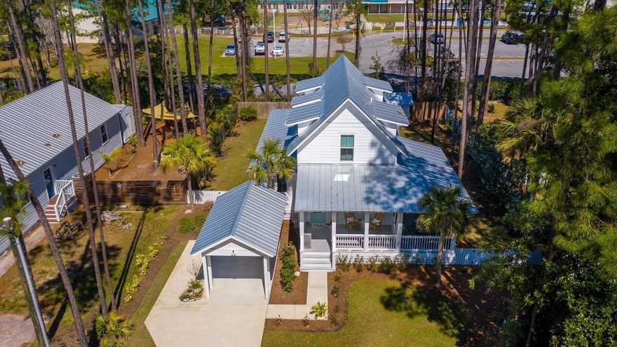 This Coastal Cottage is designed with beach living in mind.  Built in 2019, this Southern Living Home Design is located within 1/2 mile of the beach access on 30A.  The home features an open concept living area, dining room & kitchen. The cozy fireplace completes the living area.  The downstairs Master Bedroom Suite w/spacious bathroom is conveniently located on the first floor along with a guest powder room and a laundry room.  The large back yard has enough space to add a private pool.  An oversized side screened porch completes the beach living experience.  Sold Furnished with some excluded items.  All information & dimensions should be verified by Buyer