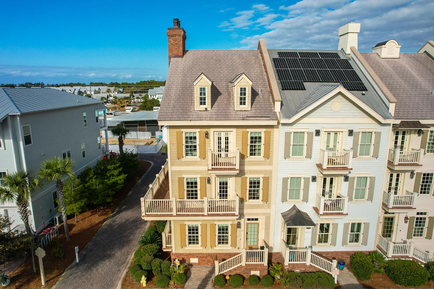 Welcome to 29 Pleasant Street, home of the Prominence South Luxury Townhomes. Located just behind the Big Chill on Scenic Highway 30A, this three-story, five-bedroom with five and half bathrooms is a welcoming family vacation home, rental, or full-time residence. This townhome offers incredible value for properties found on 30A. It is fully furnished with updated decor, SONOS surround sound, and beautiful appliances. Please ask for a full list of updates and repairs. This property features a Main House with 4 Bedrooms and elevator access to all 3 levels, a Carriage House with an added bedroom over a two-car garage, and a private courtyard connecting the two. The main level of the home is an open, fluid living dining and gourmet kitchen space that flows seamlessly together.