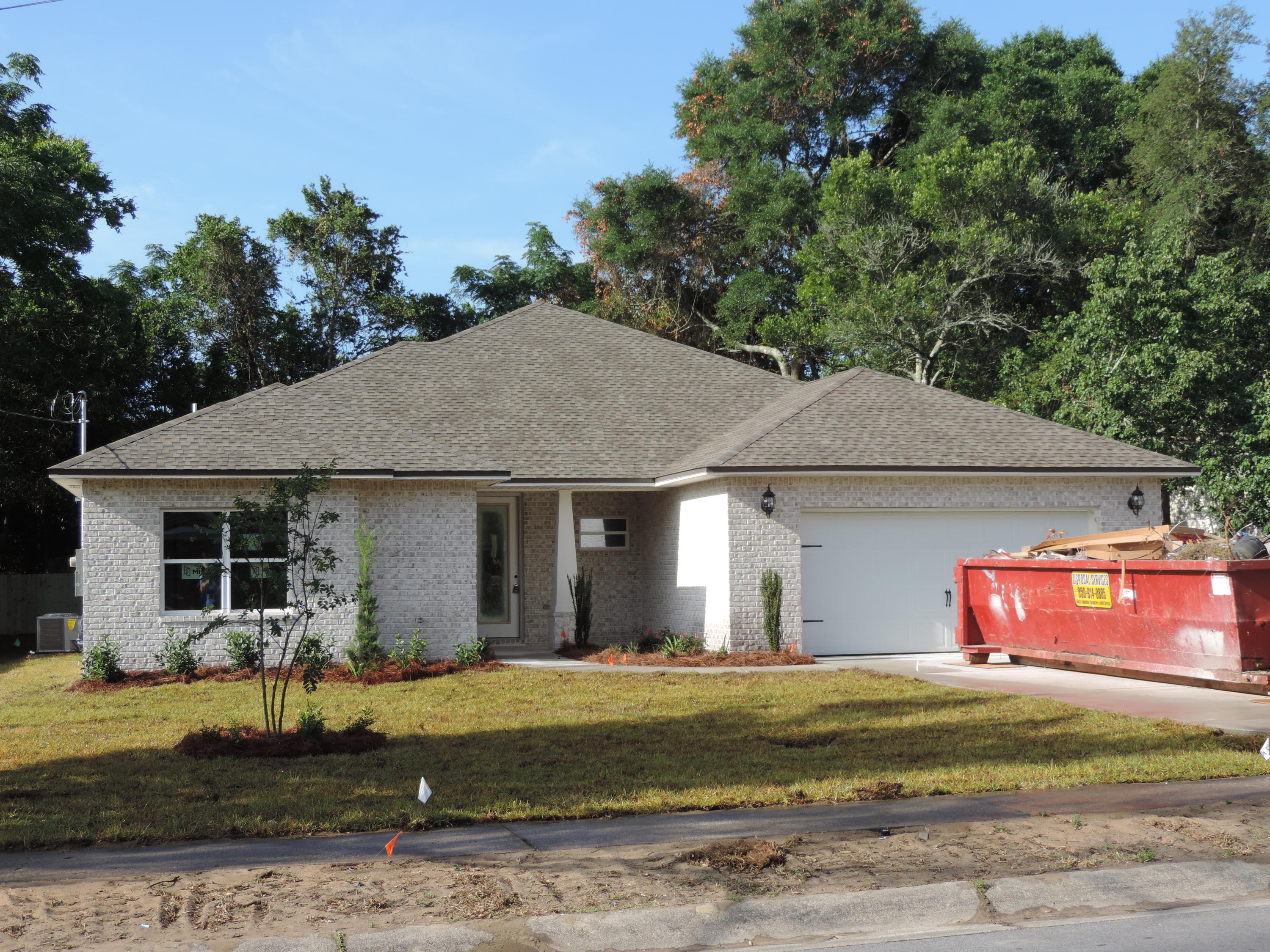 The 2398 Rhett constructed by Dubois Contracting is a spacious family favorite floorplan. Featuring 4 bedrooms and 2.5 bathrooms in a split bedroom design the plan flows seamlessly with an open Great Room, kitchen and dining room. The kitchen is open with a large quartz topped island, farm style sink, stainless appliances and a true walk in 5 feet by 6 feet pantry. The Great Room is situated to the back of the home with large windows to keep the room light. A large dining room rounds out the open planned family areas. The Master Suite is set away from the other bedrooms and has a spa like Master Bathroom with double sink vanity, separate soaking tub, large tiled shower and a huge walk in closet. The remaining bedrooms and hall bath are on the opposite side of the home, one of the bedrooms has double glass French doors and closets that allow the room to be used for either a bedroom or study / play area. A half bath and laundry round out the home interior. All rooms have a 9 feet high ceilings and a plank style vinyl for ease of cleaning and durability. A privacy fence surrounds the back yard for privacy and the lawn and beds are watered by a built in irrigation system with a private well keeping those costs low. The central location of the home the home in Fort Walton lends itself close to schools, both bases, shopping, multiple parks and of couse minutes from the beaches of the Gulf of Mexico. If you are looking for a spacious home, built to demanding standards, you need to schedule your tour of this home.