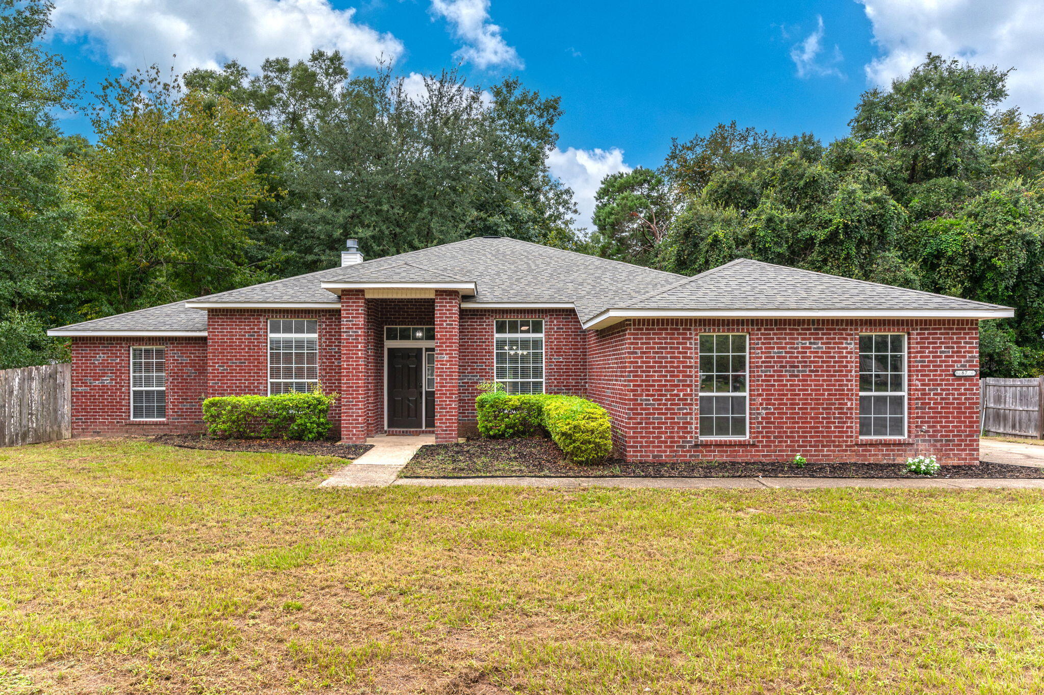 Come see this stunning cul-de-sac home! It offers the perfect blend of comfort and style. With a backyard bay view, boasting a split floorplan with a neutral color & no carpet throughout, this property is move-in ready! The spacious living room features a cozy wood-burning fireplace and French doors leading out to a large Florida room. The kitchen and dining area showcase brand new appliances, a pantry, kitchen island, and ample counter space. Additionally there is a formal dining room and office/flex room. The expansive primary bedroom includes a luxurious en suite with a walk-in shower, dual vanity, and jetted tub. Two guest bedrooms share a full bath and the fourth bedroom has its own private full bathroom! Home also has a separate building in the backyard! Other highlights are laundry room, two car garage with side entry and storage, fenced backyard with deck for outside entertaining!