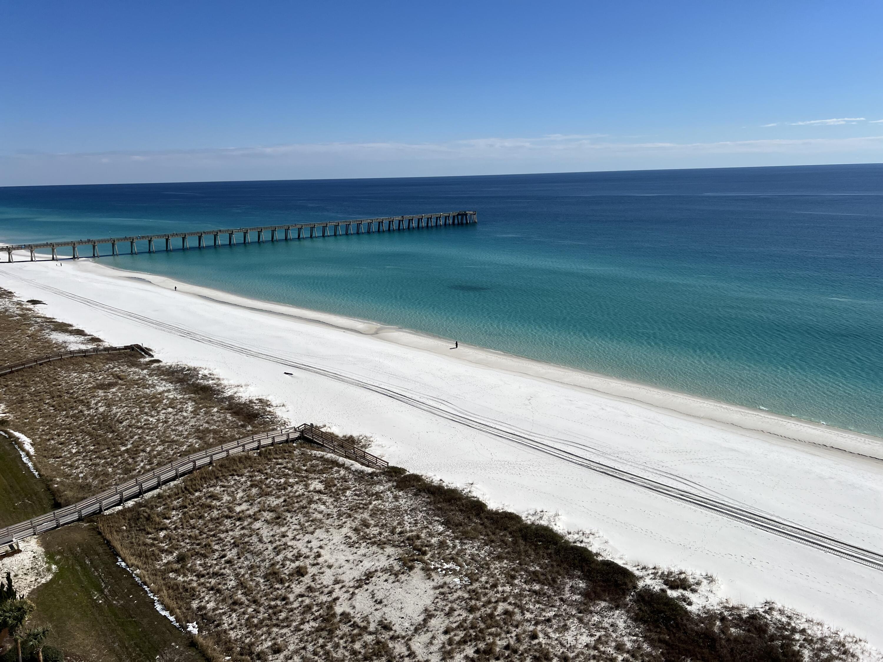 A rare opportunity to own an east side 3 bd/3ba condominium at the Pearl of Navarre. Unit 1301 is beautifully furnished with stunning panoramic views of the gulf, sound and beach. This spacious unit has many upgrades including granite countertops, wood cabinets, crown moldingand tile flooring. This condo offers a perfect blend of relaxed charm and lavish amenities.The Pearl amenities include 2 pools, hot tub, fitness room and conference room, You will appreciate the quality construction and attention to detail.