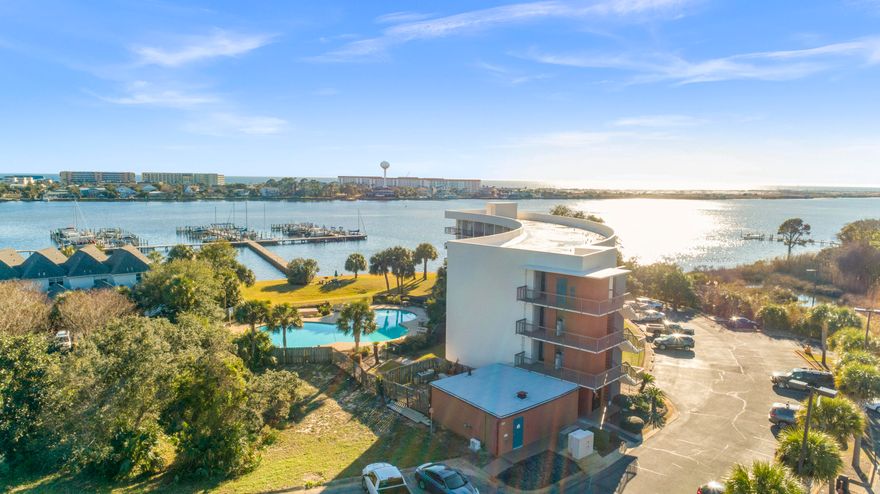 Beautifully renovated and turn key ready for rentals! Pirate's Bay Unit 203 has been updated, has a great rental book of business to hand over and currently has a boat slip tenant paying $120/mo. Overlooking the huge pool and with amazing views of the sound, Pirate's Bay is centrally located in Fort Walton Beach. Seller has meticulously decorated and updated this unit to create maximum rental income. Boat slip #E15 is a 36' slip.