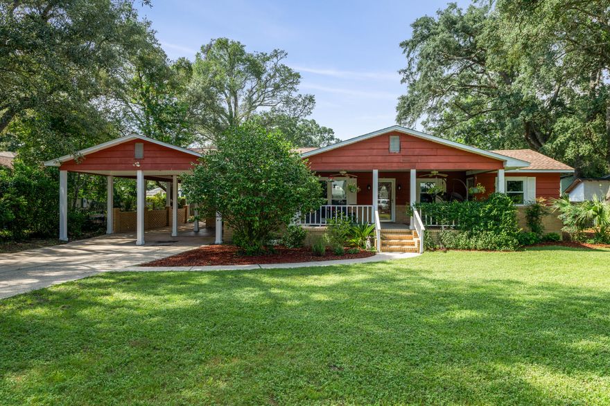 Welcome to this 4 bedroom, 3 bathroom gem nestled in the heart of Gulf Breeze Proper - centrally located on Fairpoint Dr - just minutes from shopping, dining, sports, local schools, and Pensacola Beach! This unique property offers a perfect blend of modern updates and classic charm. Starting with the CUTEST covered front porch to sit outside and relax with your morning cup of coffee, and the covered carport with extended concrete pad for ample parking for friends, family, or to store your boat behind the gate. This home also features all new windows, refinished hardwood floors, and a fully remodeled and BEAUTIFUL kitchen with large kitchen island with breakfast bar, quartz countertops, stainless steel appliances, and an undermount tub sink - perfectly framed in the bay window for the best  view of the backyard. Just off the kitchen is the dining room that has a door leading to the open deck in the expansive backyard. Down the hall are all of the bedrooms, each with Jack & Jill bathrooms - giving access to an ensuite from every room. The front bedroom even has its own entrance from the front of the house - great for a lockout or mother-in-law suite. Schedule your showing today and check it out for yourself!