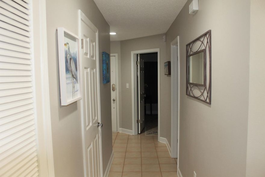 Adorable FULLY FURNISHED ground floor, one bedroom condo, tucked away in Lakeside Village in desirable Bluewater Bay. Featuring a spacious living/dining room combo and a covered back porch with relaxing panoramic lakefront views. Full kitchen comes equipped with beautiful GRANITE countertops, stainless-steel appliance package, stackable washer/dryer, and an eat-in nook with breakfast bar.Other amenities and features include maintenance-free tile throughout, updated bathroom with Eco-friendly toilet, extra customizable storage-pantry space, and his & her closets.Enjoy an easy commute to restaurants, shopping, military bases, and beautiful white sand beaches.