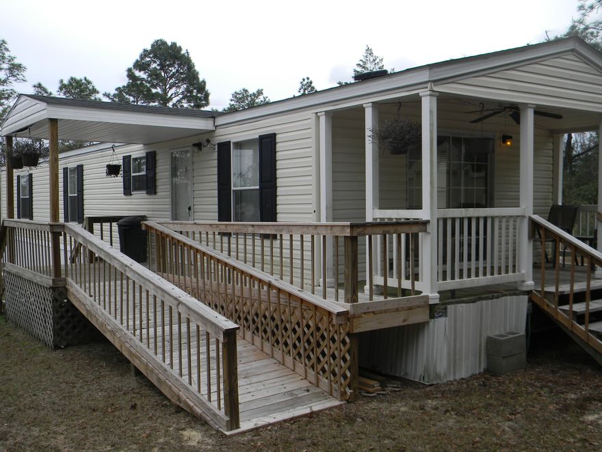 Well-maintained 2 Bedroom, 2 full bath mobile home. A short walk to Sunset King Lake Campground which offers fishing, swimming, camping and boating to members. There is a large covered deck off the living room, and a nice covered deck at the front entrance complete with wheelchair ramp. Open floor plan makes this home appear larger. Great workshop at the rear of the property is plenty large enough for storage AND projects! Comfortable and Affordable in a great location! Furniture can be included with acceptable offer.