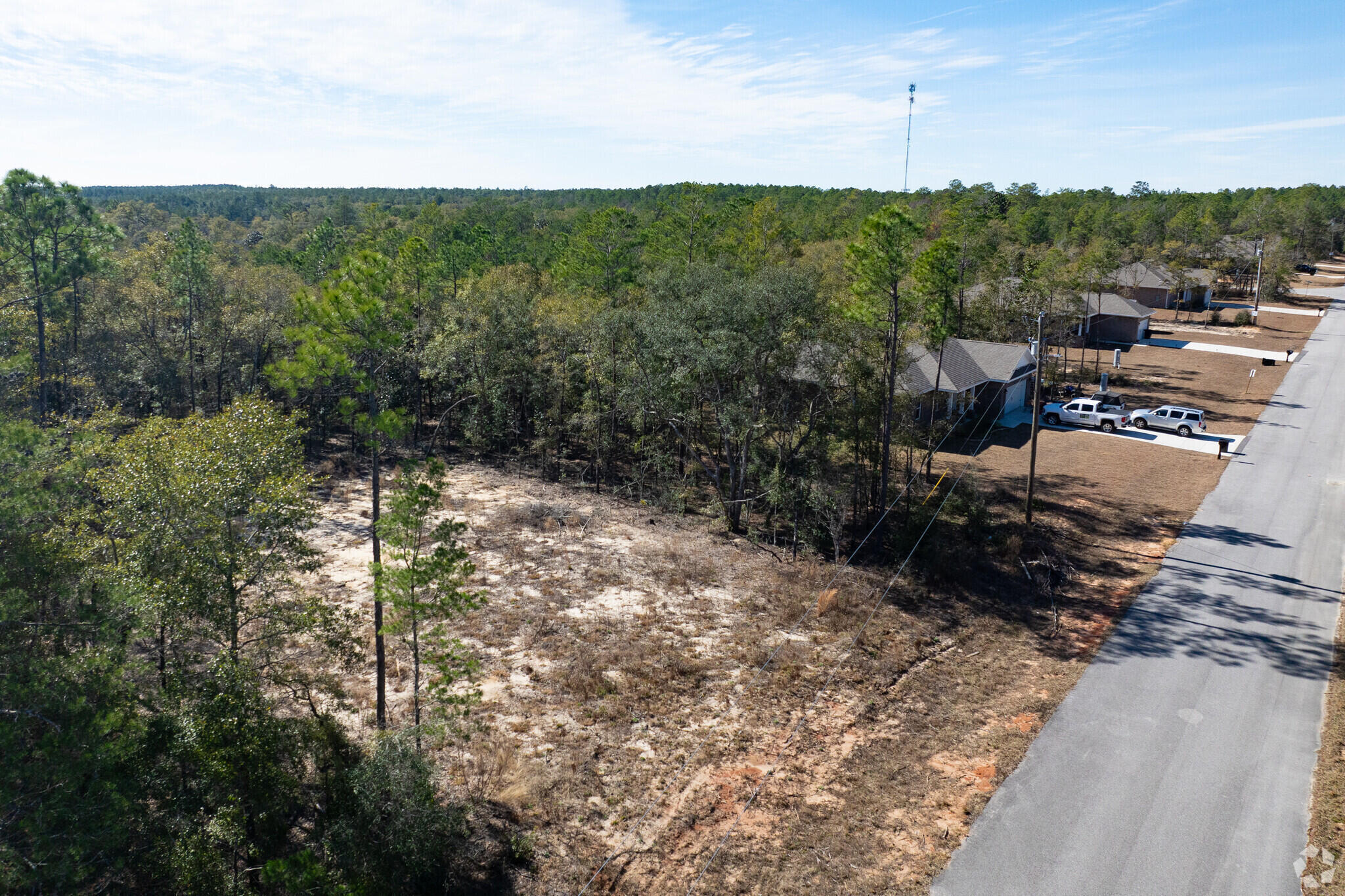 1.57 acre lot Zoned Rural Village. Flood Zone is X. The lot is cleared cleared and filled and an existing paved road with a cul-de-sac. Can be sold individually or all 16 lots. Another option : pick your lot and work with SHS, a local Walton County Builder. AVERAGE BUILD TIME 4 MONTHS. Wildwood Lakes Phase III offers a fully approved residential development of 16 single-family homes in an up-and-coming market. Prime position 1 mile off US 90 and just 15 minutes from US 331 and I-10, able to reach Destin and Fort Walton in less than an hour. These nearby connections will place employment and recreation hubs at residents' fingertips. The area is rich with natural foliage dotted by clear cold-water springs and bounded by sparkling white sand beaches, providing endless opportunities for outdoor recreation. The Eagle Springs Golf and Recreation Park is approximately 5 miles away and quickly accessible via US 90. The area also provides abundant high-quality shopping and dining options. National retailers, including Walmart Supercenter, Winn-Dixie, Lowe's, Walgreens, Tractor Supply Co., Starbucks, Chick-fil-A, Taco Bell, and many more, are located within just 10 miles. MOTIVATED SELLER, BRING ALL OFFERS. More lots/ land available.