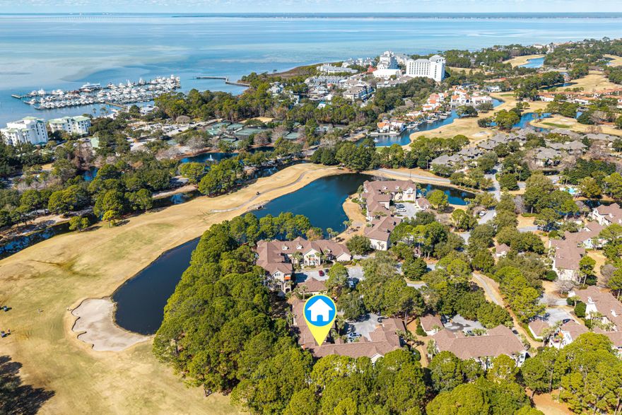 Now on the market is this premier, highly sought spacious  3 BR, 3.5 Bath two-level Turnberry Villa with spectacular cathedral ceilings and wall-to-wall windows that flood the space with natural sunlight and showcase the picturesque golf course setting.  The unit is in excellent condition being never-rented and used as a second home by a single owner.  Unwind on the open terrace while taking in sweeping views of the lake and 9th fairway of the Baytowne golf course.  Featuring three ensuite bedrooms, with the master on the main level, and two bedrooms upstairs.  Recent upgrades include stainless steel appliances, HVAC, and water heater.  Ideally located a short walk to the Raven/Baytowne golf course, Baytowne Marina, Sandestin Tennis and Pickleball center, and the vibrant Village of Baytowne Wharf; home to dining, shopping, concerts, festivals, and year-round family events. This residence places the best of the resort right at your fingertips.  Turnberry owners will soon benefit from a beautification project estimated to begin in the fall. Owners and their guests have access to the Turnberry/Magnolia Bay community pool in addition to the 2 Sandestin Owners' Association pools nearby.
As an introduction to the Sandestin lifestyle, we invite our new owners to explore amenities that make Sandestin special. The listing brokerage and seller(s) are presenting the buyer(s) of this property with (2) 90-minute rounds of Tennis court time, a golf foursome at one of our three championship courses, and a round of golf for up to four (4) players at the unrivaled Burnt Pine Golf Club.
Sandestin Golf and Beach Resort features more than seven miles of beaches and pristine bay front, four championship golf courses, 15 world-class tennis courts, a 226-slip marina, a fitness center, spa and celebrity chef dining. Shop, dine and play at the charming pedestrian village, The Village of Baytowne Wharf and more. Inside the gates of the resort, residents enjoy a balanced lifestyle of high-class living, spanning the 2,400 acres from the beach to the bay. Everything within the gates of the resort is accessible by golf cart or bicycle. The entire resort is interconnected by miles of pedestrian, bike and golf cart paths that weave through groves of live oaks, meandering past natural lagoons, fountains, man-made lakes, and meticulously landscaped fairways.