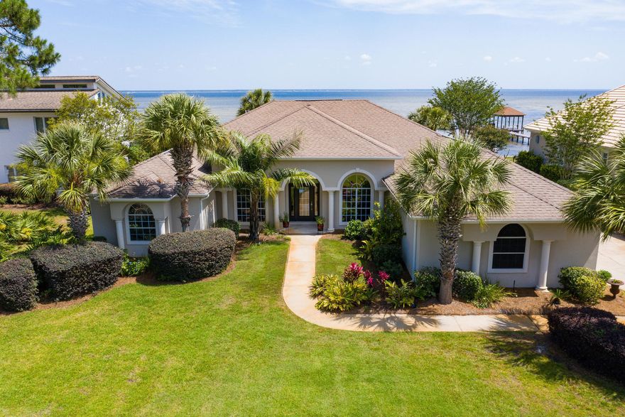 An incredible home in the ideal location. This beautifully renovated home is move-in ready. With new custom kitchen, three remodeled full baths, rebuilt pool, dock, lanai and more, you won't have to do a thing. Except maybe pull up a chair on one of the largest private docks on the bay and enjoy your view of sunrise or sunset. The entire rear of the house has unobstructed views of the bay, and of the almost 2000 SF outdoor living area. A newly redesigned saltwater pool centers the lanai, with multiple seating and dining areas. Inside you will find a kitchen designed for efficiency and style, with views of the pool and bay. The huge MBR has bay views, and the ensuite bath features custom shower, soaker tub, double vanities, and even a bidet. Plus, the beach is only a mile away!