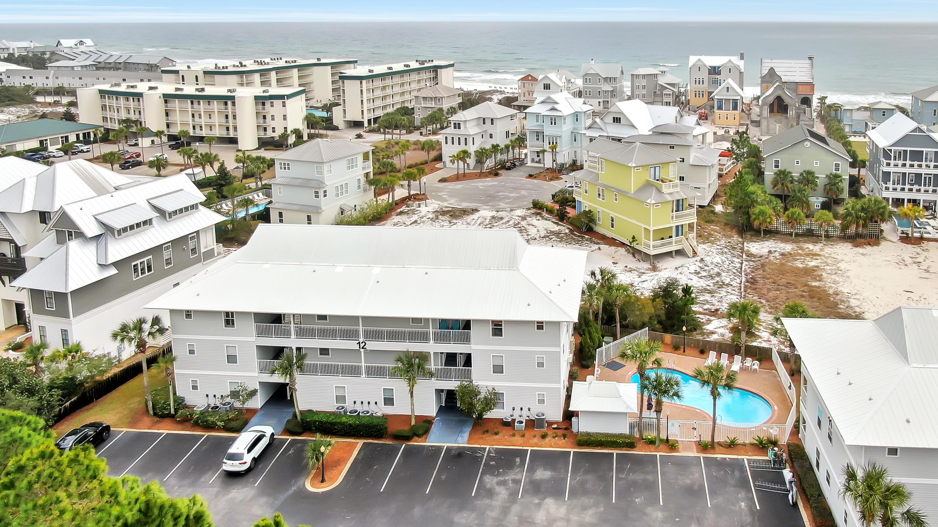Welcome to the beach! You can hear the waves calling from your private balcony of this cozy 3 bedroom condo in Seagrove. Completely furnished and turn-key ready, you can use this condo as an investment, second home, or you can become a local and live here permanently. Beachside Villas is tucked away close to the beach offering pristine privacy, two swimming pools, tennis courts, shuffle board, a beautiful lake for kayaking, and a boardwalk to the beach access. Rentals numbers for 2019 were $42,615. For the past 7 years, the ROI average has been $38,000. Virtual tour available upon request.