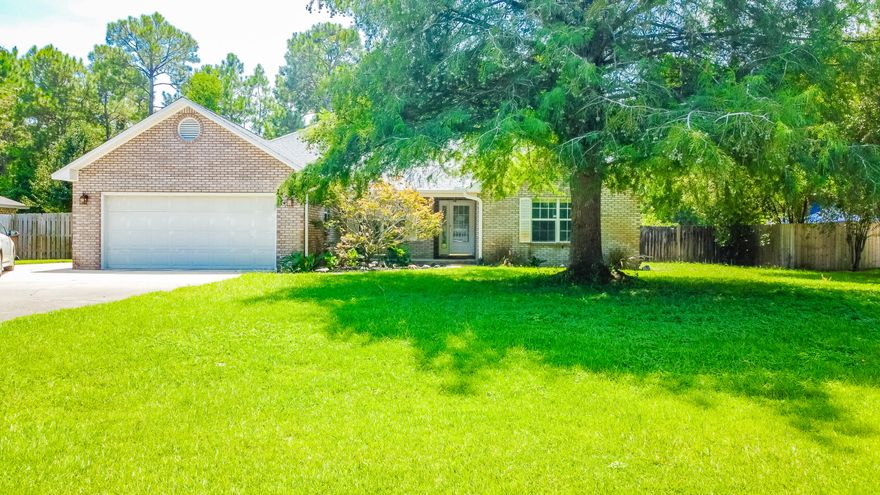 Beautiful home with several upgrades in Navarre! Located in Holley By The Sea, the property features a newer roof (2023), solar panels, updated HVAC (2020) & hot water heater. The exterior showcases a fenced backyard with several fruit trees, sprinkler system, yard building & an open patio area that is just outside the spacious sun room. The interior includes vaulted ceilings, updated flooring in living areas, & remodeled bathrooms. The owner's suite includes plenty of natural light, a sitting area, & an updated bathroom with a walk-in shower, granite countertops & custom cabinetry.  Enjoy access to the community recreation center's amenities including swimming pools, tennis & basketball courts. The property is located within 6 miles of Navarre Beach & within 15 miles of Hurlburt Field.