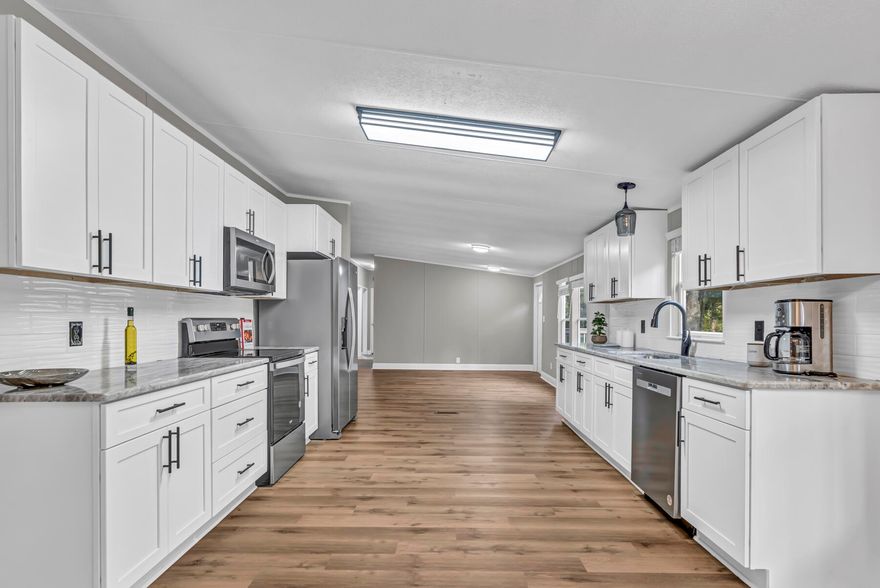 Experience the epitome of luxury with this exquisite 4 bedroom and 2 bathroom home that has undergone a complete makeover with over $132,000 in upgrades. The stunning 2,300 square foot space features a brand new 2024 roof, 2024 AC, 2024 hot water heater, a gourmet kitchen with granite countertops and stainless steel appliances, two impeccably designed bathrooms, new floors, doors, door knobs and hinges, fresh paint inside and out, new drywall, stylish fans and lights, and energy-efficient windows that lead to a picturesque deck. This home is a true masterpiece!