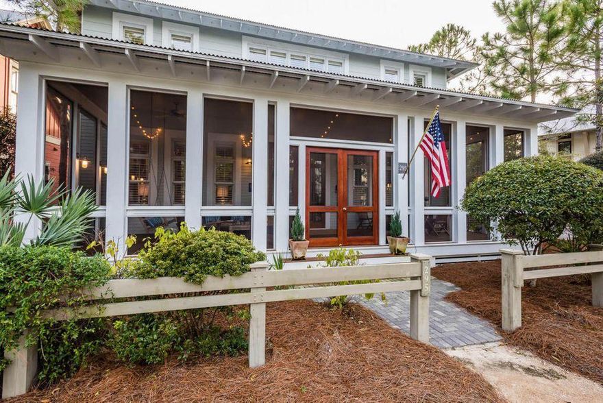 Featured in Coastal Homes and Lifestyles, this beautiful Watercolor home is ideally located 150 feet from the new Camp Watercolor. Astounding design paired with a beautiful, fresh pallet exemplify this recently renovated home. Offering 4 bedrooms and 5 bathrooms, this property features a well-planned open concept great room with two living spaces; a large airy screened for porch for al-fresco dining; a spacious outdoor back porch for grilling; a gourmet chef's kitchen; a large first floor master suite; and two additional guest suites and a charming bunk area. The master suite offers a 2 large walk-in closets and an over-sized bedroom as well as a fully updated bathroom featuring a large jetted soaking tub and spacious walk-in steam shower. This property also includes a two-car garage and private carriage house; complete with full kitchen, living room, private bedroom and bath!

The interiors of this home were professionally selected, boasting an incredible vaulted ceiling, large windows, a grand fireplace, luxury appliances, quartz countertops, and custom tilework throughout. The large outdoor living spaces create substantial amounts of additional living area beyond heated and cooled. Situated on a corner lot across from the manicured park, this home is conveniently located near all of the Watercolor amenities including the Watercolor Beach Club; shopping and dining at Watercolor Crossings; and Camp Watercolor.  Do not miss this one-of-a-kind opportunity!