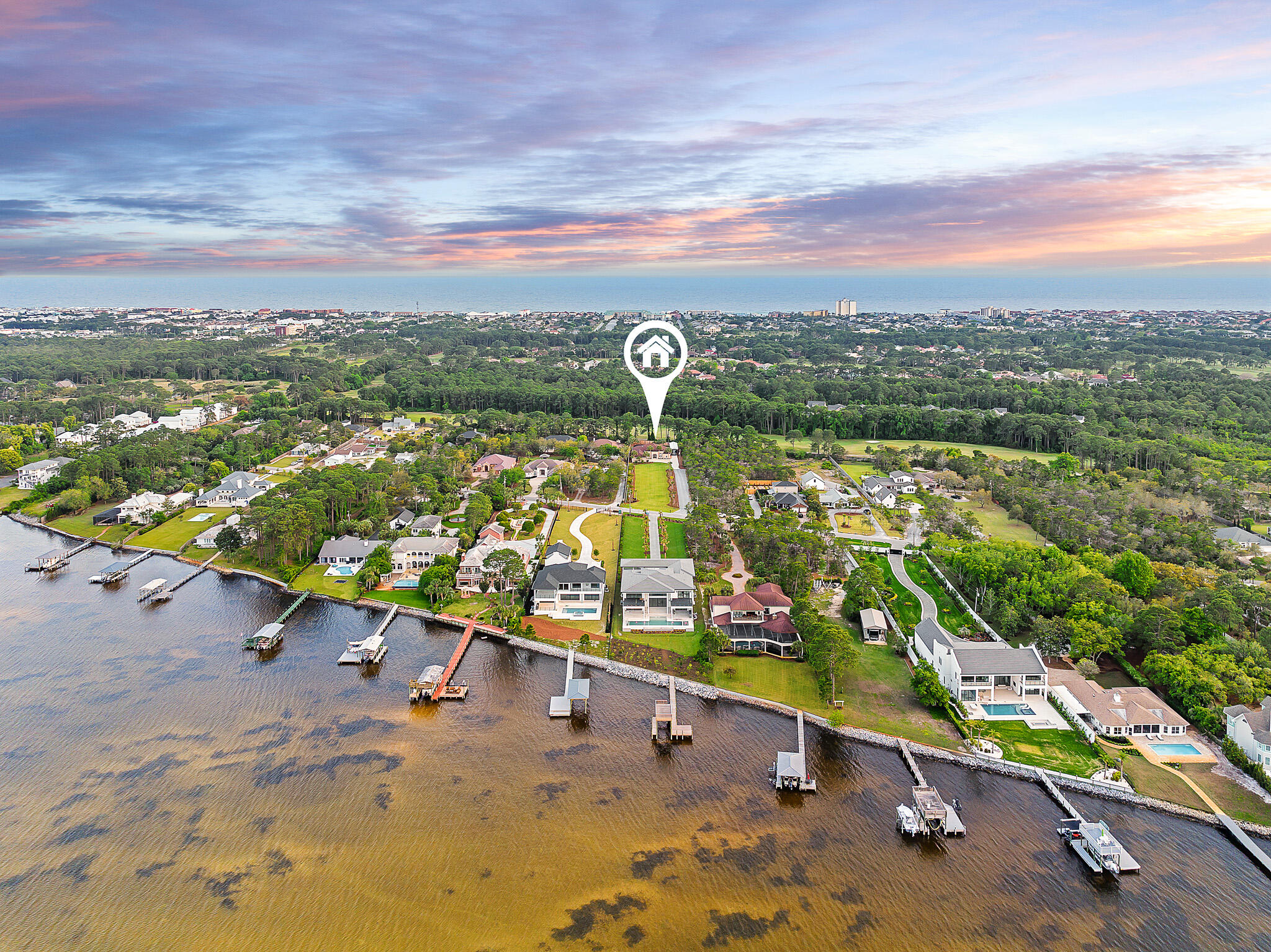 Introducing an elegant single-family home that epitomizes a community of waterfront charm and luxurious living in Miramar Beach's Whispering Oaks; which stands in a tranquil neighborhood, offering a lifestyle of comfort and convenience just minutes away from the beach, eclectic dining, and shopping. Positioned on a 1.04 acre lot ensuring privacy and an estate experience. The resort-like, screened-in, heated saltwater pool is perfect for year round leisurely swims and lively pool parties. The outdoor area is complemented by an outdoor kitchen complete with top-of-the-line appliances, including an Dacor built-in grill and hood, warming drawer, vevor pool refrigerator, and an entertainment center.