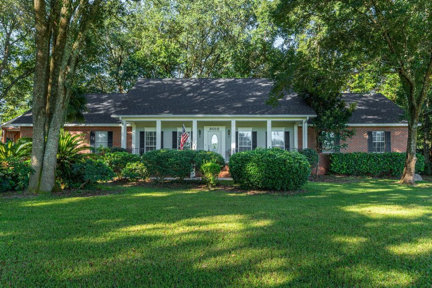 Take your time here! Whether you're inside making memories with family and friends or rocking on the front porch reminiscing while it rains, this colonial built home welcomes you. The 3 car garage gives space for multiple vehicles. While bringing you back to the good old days, the roof has been recently replaced (2019/2020) alone with the AC. This 4 bedroom 2 bath is boasting with huge oaks and is the definition of southern living. Store your boat in a specially designed shop and let the dogs out to roam in their own fenced in area.
