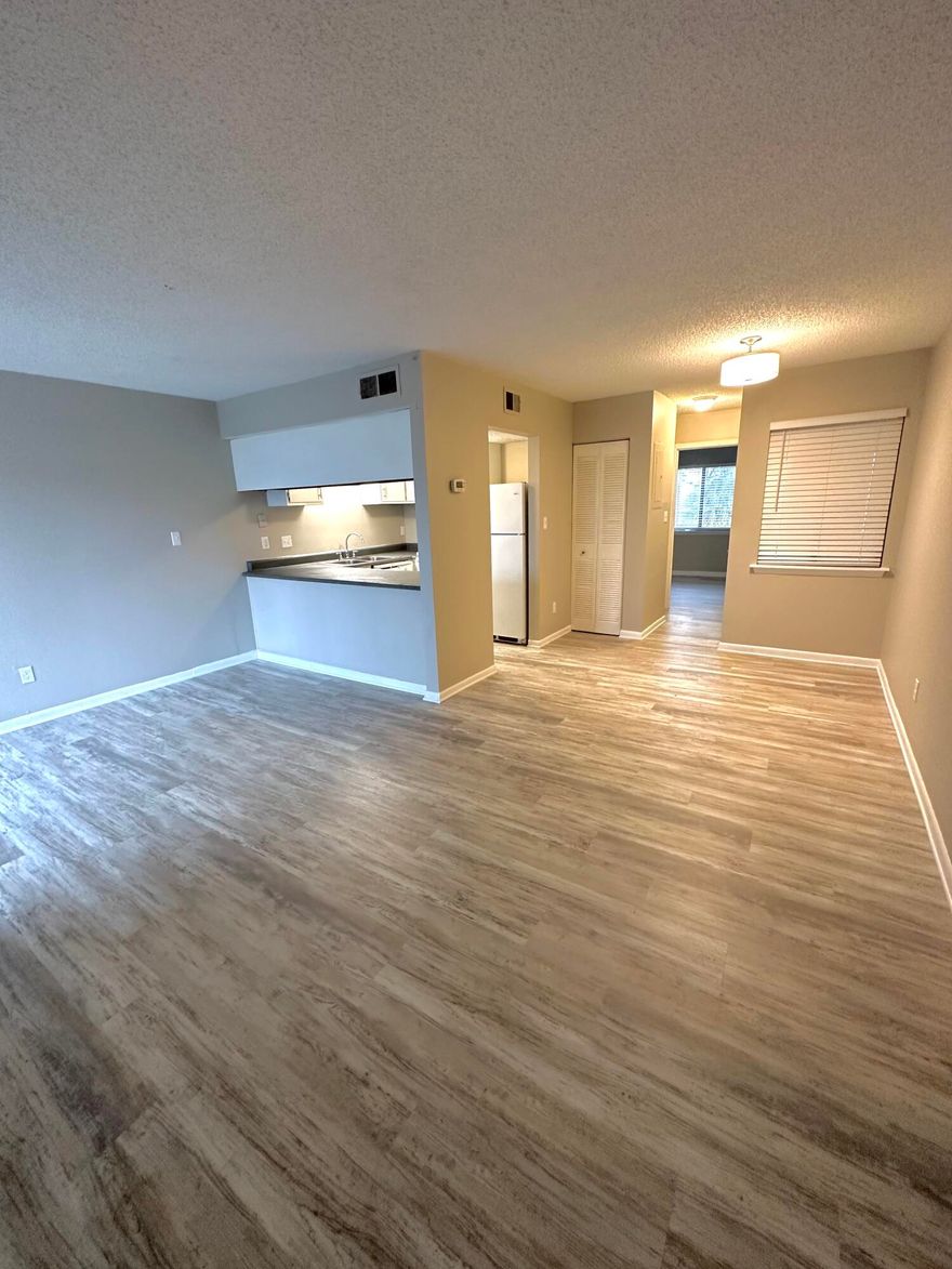 Fountainhead is a waterfront community located on the inter-coastal waterway.  This is a second floor unit that has one bedroom and one bath and has been updated with luxury vinyl planking throughout.  Appliances and air conditioning system are about 2 years old. The unit has lots of green space around the unit and overlooks the tennis courts.  The community has lots amenities to include a dock (boat slips can be rented on a first come, first served basis), beach with kayak and paddle board storage racks, a very nice laundry room, pool, and rec room overlooking the water.  HOA fees include water, sewer, garbage as well as building insurance and maintenance.