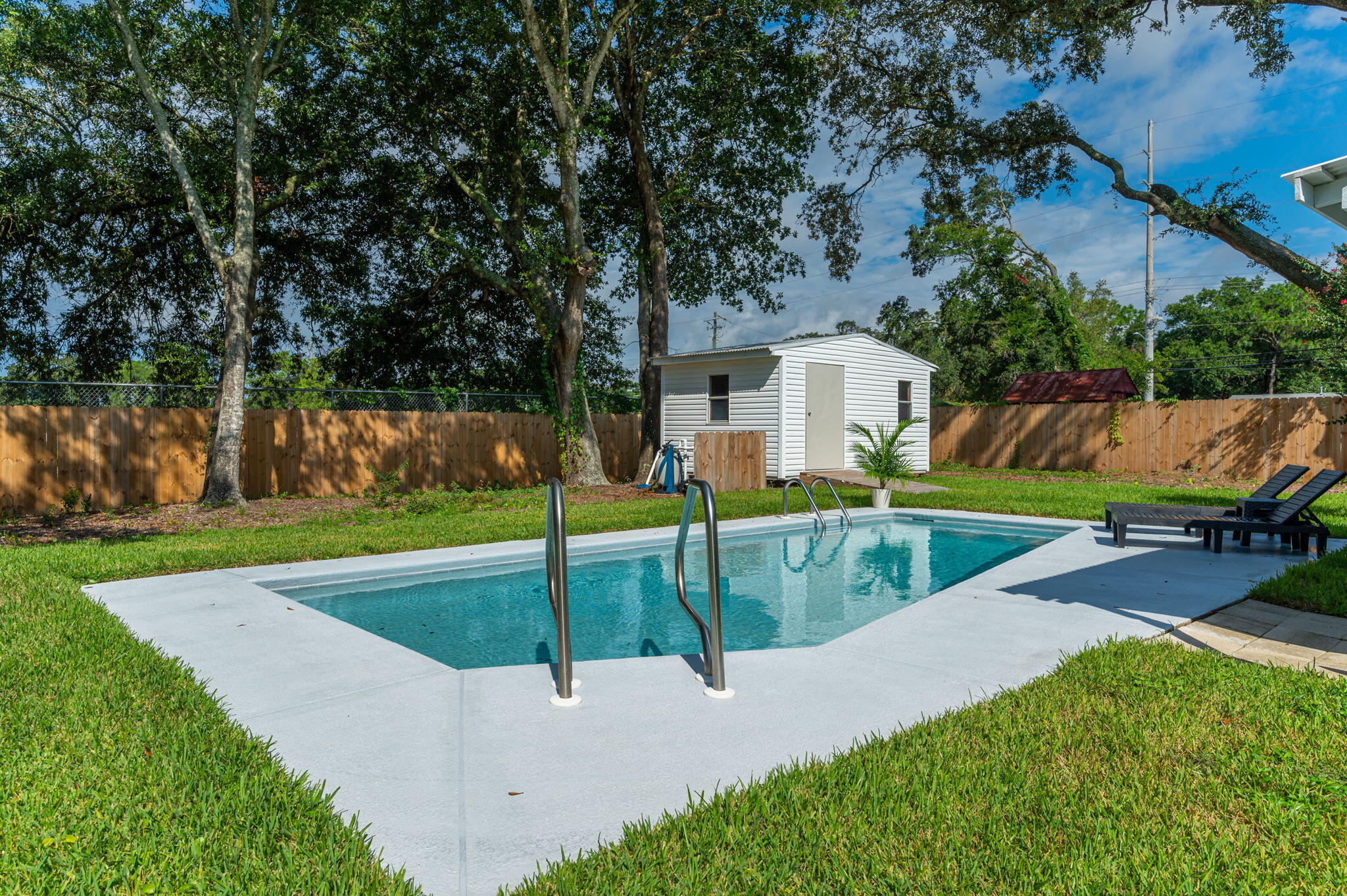 Discover the epitome of modern comfort in this exquisitely remodeled 4-bedroom, 2.5-bath POOL home with a thoughtfully designed split floor plan. The heart of the home boasts a redesigned kitchen featuring brand-new cabinets, stainless steel appliances, and a spacious pantry, seamlessly connected to a large laundry room for added convenience. Elegant new flooring spans the entire house, enhancing the fresh, contemporary feel. Enjoy cozy evenings by one of the two fireplaces, strategically placed in the living room and family room. The master suite has been elevated with a luxurious walk-in closet and a beautifully updated bathroom, complete with tile showers and a double vanities.Each of the other three bedrooms has been thoughtfully updated, providing comfort and style. The 1.5 additional bathrooms have also been refreshed with modern finishes and fixtures.
Step outside to your covered patio, overlooking a sparkling pool that has just been upgraded. Your private backyard features a new privacy fence and freshly laid sod, creating a perfect backdrop for outdoor entertaining and relaxation. There is also a large yard building (16x10) with electricity perfect for all your storage needs. The home includes a storage room attached to the house that is an additional 40 sqft. , there is not a shortage of storage with this update home.
With all-new lighting and meticulous attention to detail, this home is ready to offer a sophisticated and serene living experience.
Don't miss this beautiful home conveniently located to Hurlburt Field, the Emerald Coast beaches and downtown Ft. Walton Beach.
Roof-2021
HVAC-2018
Hot water heater ( gas)- 2013
Heat- gas
