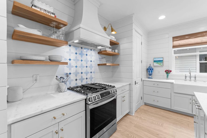 Welcome to your dream home located in the Winter Garden area of Watersound Origins. This exquisite 4 bedroom and 3.5 bath Huff built home has undergone a total renovation.  From the new whitewashed floors to the custom window shades, the entire home has been transformed into modern elegance with thoughtful design throughout each room. 
Step into luxury as you enter the spacious chef's kitchen which has been completely renovated featuring a stunning large island adorned with dolomite countertops; perfect for entertaining guests or enjoying family meals.  Indulge in the convenience of top-of-the-line appliances including a custom-built Miele coffee bar, ensuring your mornings start on the right note.  Other features include a custom marble backsplash, white oak café shelves, Fisher and Paykel refrigerator, under counter ice maker and Miele Microwave and Dishwasher.  Appliances are finished with custom cabinet panels for seamless elegance.
No detail in the home has been spared to maximize the space including the hallway entry and separate laundry room which have been outfitted with custom-built California Closets ensuring every belonging has its place and to accommodate a busy but organized lifestyle.   
The kitchen opens to a spacious family room filled with natural light streaming throughout the home supplemented with Serena & Lily designer lighting.  The primary bedroom is off the family living area and has a spacious bathroom suite with a new soaking tub and walk-in closet and built-in shelving.  
The upstairs includes well-appointed rooms with built in bunks in the bedrooms and California Closets. The bathroom has been transformed with a vintage, cast iron double sink and lighting to create a fun filled space. 
The property features lush landscaping and outdoor living spaces that are perfect for enjoying the year-round sunshine. Whether you're hosting a barbecue with friends or simply enjoying a quiet morning coffee, the screened in patio and landscaped yard provide the perfect backdrop for outdoor living.  This home also offers access to the incredible amenities of Watersound Origins, including a championship golf course, fitness center, tennis and pickleball, swimming pool, walking trails and a dock on Lake Powell.   

Don't miss your chance to experience the ultimate in coastal living with every detail of the newly renovated home evoking the serenity and charm of coastal living.