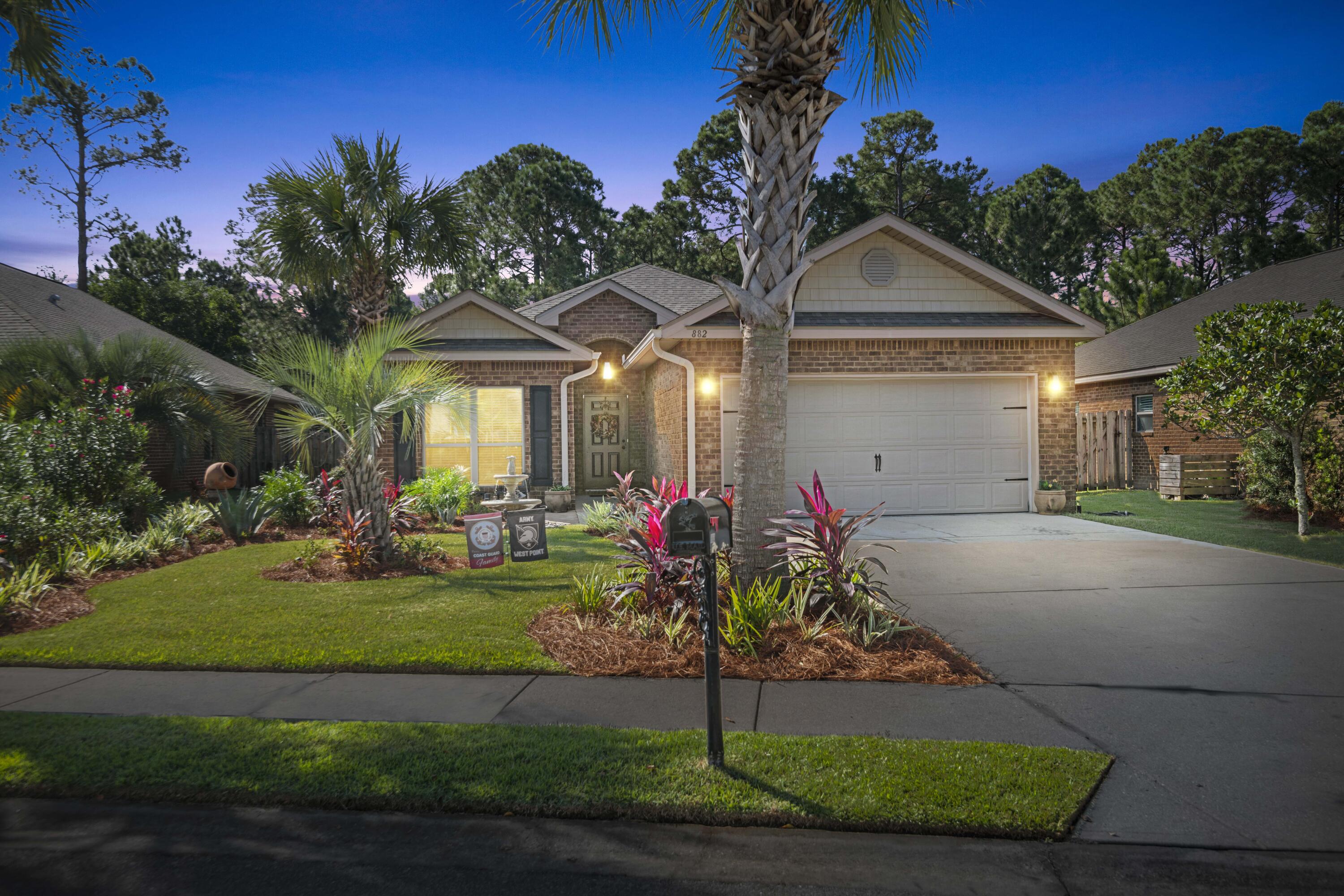 Head turning curb appeal with a large beautifully landscaped yard, and a very comfortable single story four bedroom layout, await you in Driftwood Estates!! Nestled in-between the Choctawhatchee Bay and the Gulf of Mexico, the community features mature Florida landscaping, community pool, clubhouse, fishing ponds and walking trails. The open floor plan flows seamlessly and comfortably. You'll enjoy the hardwood floors in living areas and primary bedroom, upgraded tile, a spacious kitchen/dining open concept, granite counter tops, and new stainless steel appliances! Enjoy the abundance of window and natural light throughout ! You'll find yourself ending the day on the covered patio perfectly positioned to enjoy southwest sunsets and a view of the peaceful pines in your large backyard. Driftwood Estates is centrally and conveniently located to Sacred Heart Hospital, The Shoppes at Grande Boulevard, Sandestin Resort, Tops'l State Park and the beautiful beaches of South Walton. 