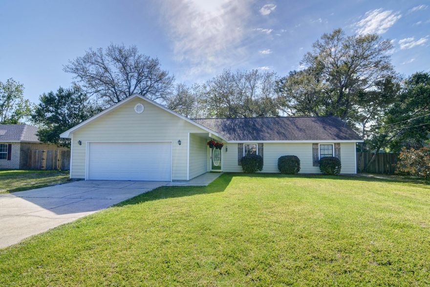 Amazing Home in the center of Gulf Breeze with easy access to HWY 98 and Tiger Pointe Golf Course . Cute curb appeal with covered walk under porch entrance, mature bushes and wooden decorative shutters ~ on entering the home you will appreciate the open flow to the main family living area offering a flagstone fireplace and staggered lay tile floor ~Dining area can accommodate a large table & has French doors to the back patio.Flush granite breakfast bar wraps around the kitchen with lots of cabinet and countertop space~ SS appliances ,pantry ~ under-mount sink with picture window and opens to a large eat in breakfast area with bay window over looking the back garden .Master bedroom has 2 by-fold closets and a walk in master bathroom accommodating a double vanity and separate step in tub/shower .Additional bedrooms are a good size with plenty of closet space and a great additional bathroom . Home offers a 2 car garage and an amazing back garden which is fully fenced with huge mature Oak trees for shade ~Full length patio and an area set out for a fire-pit and gathering space..Perfect back garden for entertaining and enjoying those wonderful Florida evenings .......call today to make an appointment to view this Gulf Breeze home before it's gone .