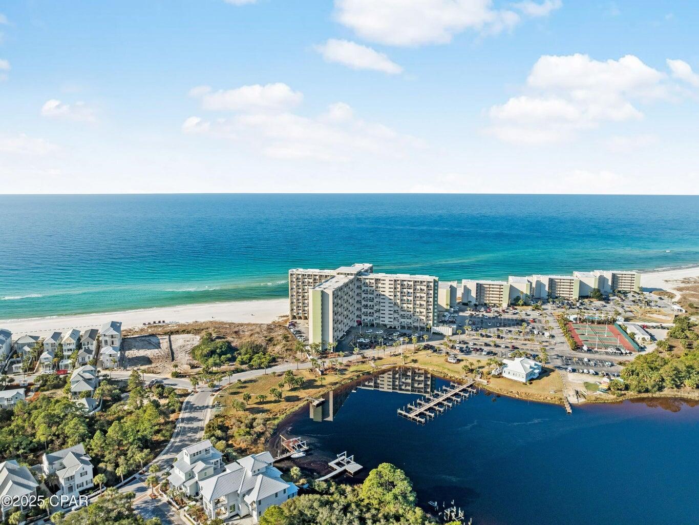 A1 PH 14 Perched on the west end of Panama City Beach, adjacent to Lake Powell, Pinnacle Port offers some of the most breathtaking coastal views imaginable. This two-level penthouse condo is a rare find, boasting an ideal layout with two bedrooms and full baths upstairs, while the kitchen, living/dining area, and master suite are conveniently located on the lower level.